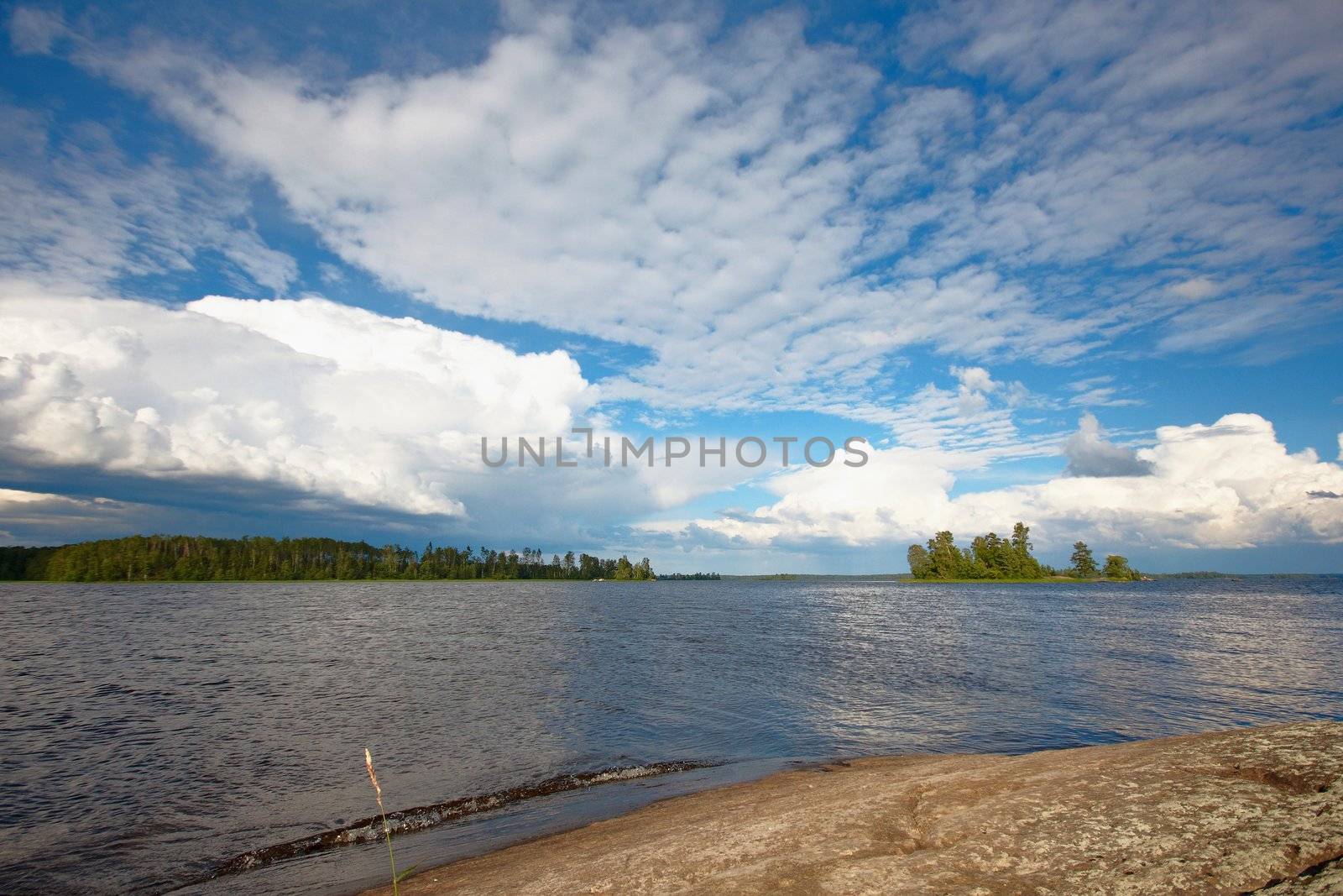 Water landscape with the lake and clouds