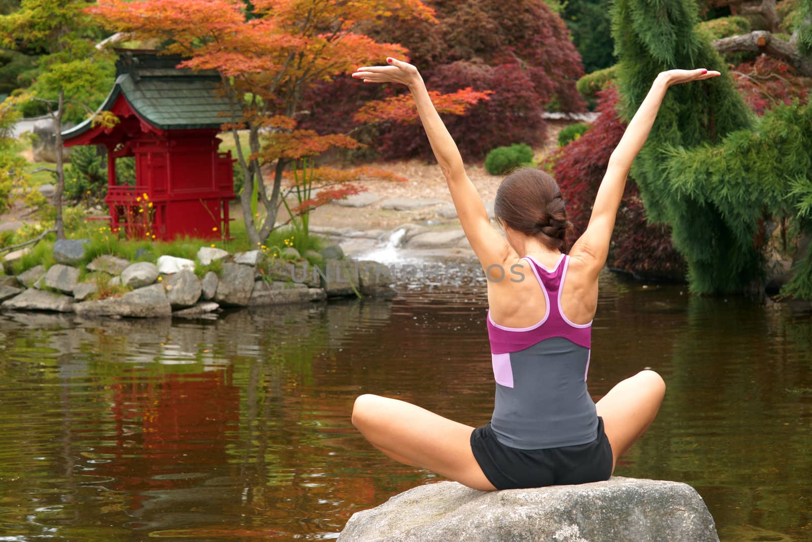 A woman practices Yoga in a beautiful place