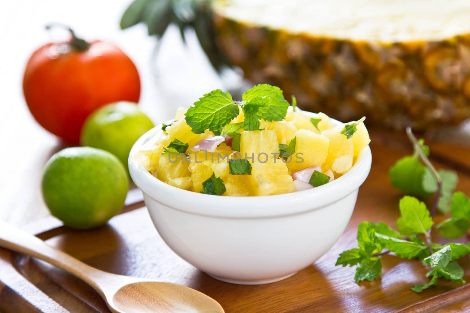 Pineapple salsa salad by fresh tomato,mint and pineapple
