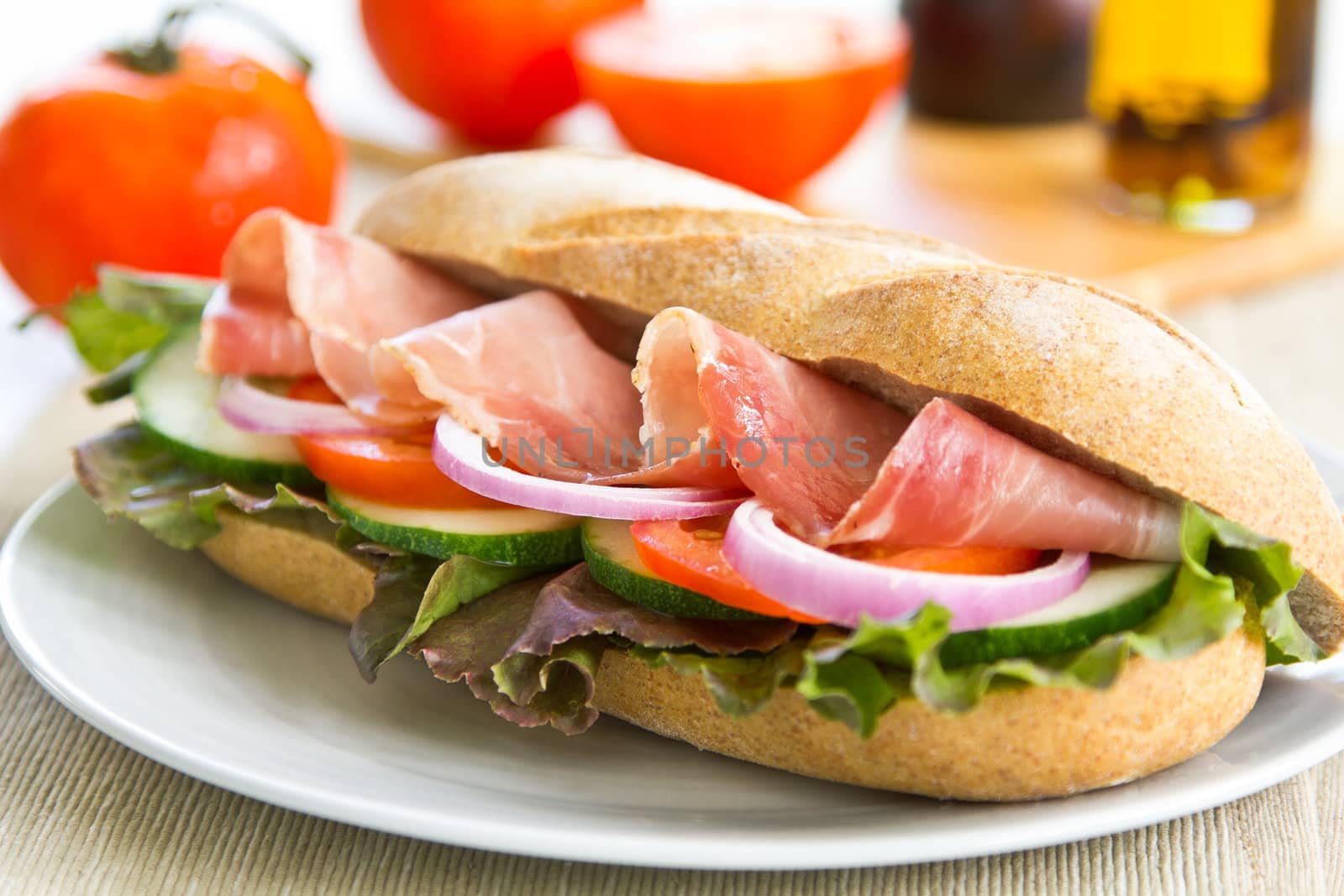 Prosciutto sandwich by fresh tomato and pepper