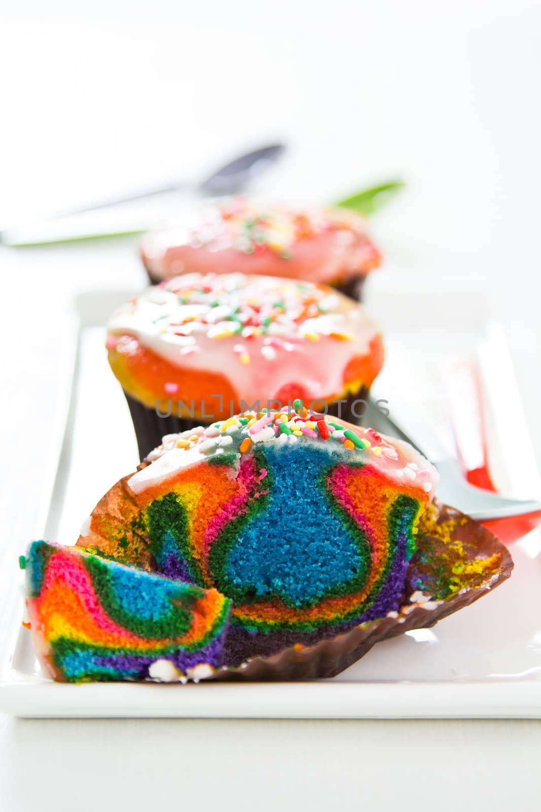 Colourful Rainbow cupcake with sugar on top