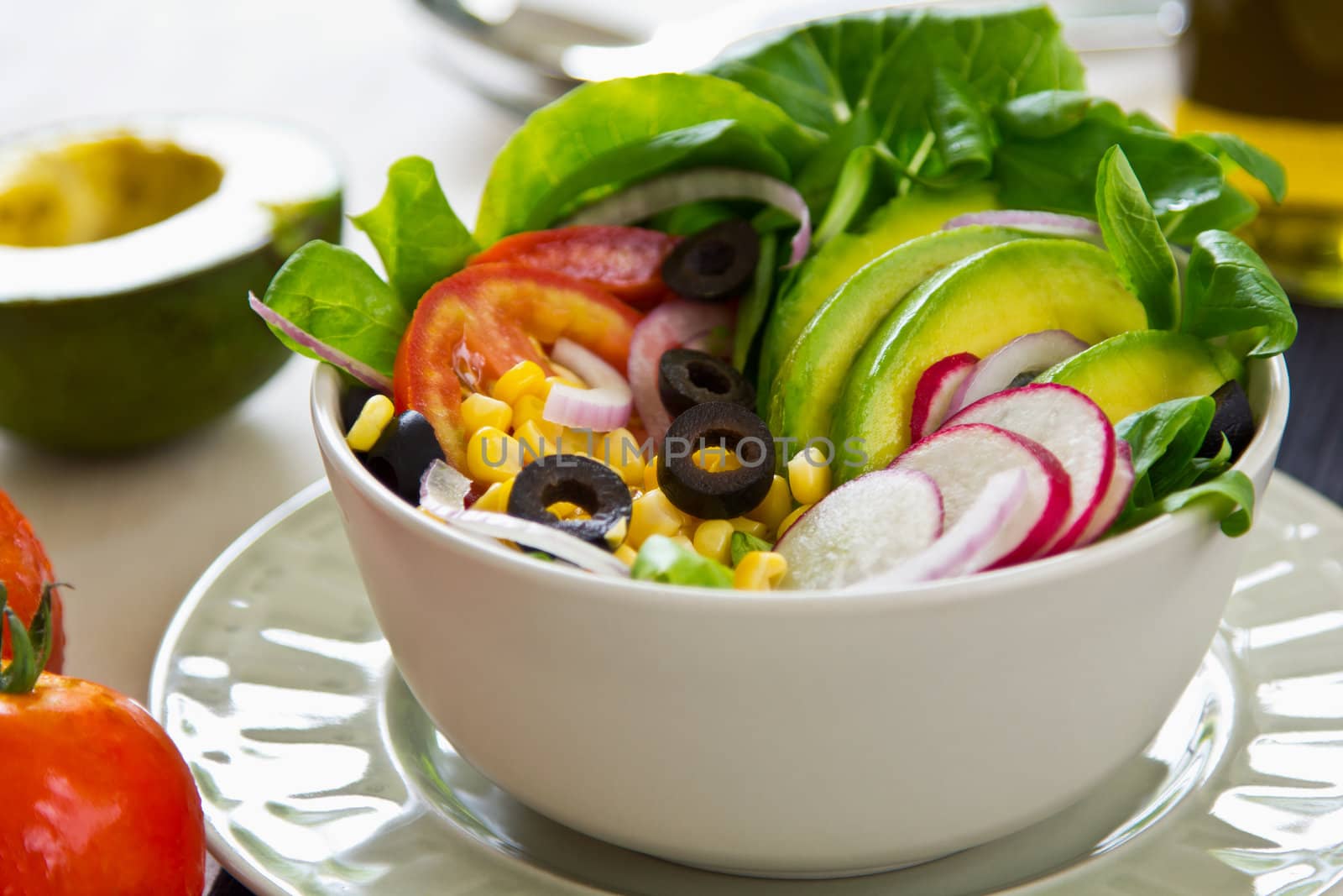 Avocado with sweetcorn ,radish and olive salad