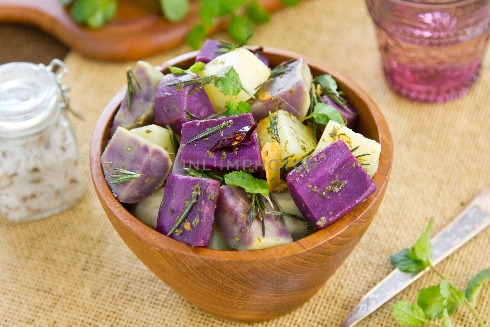 Potato and sweet purple potato salad with rosemary and mint by chilli oil