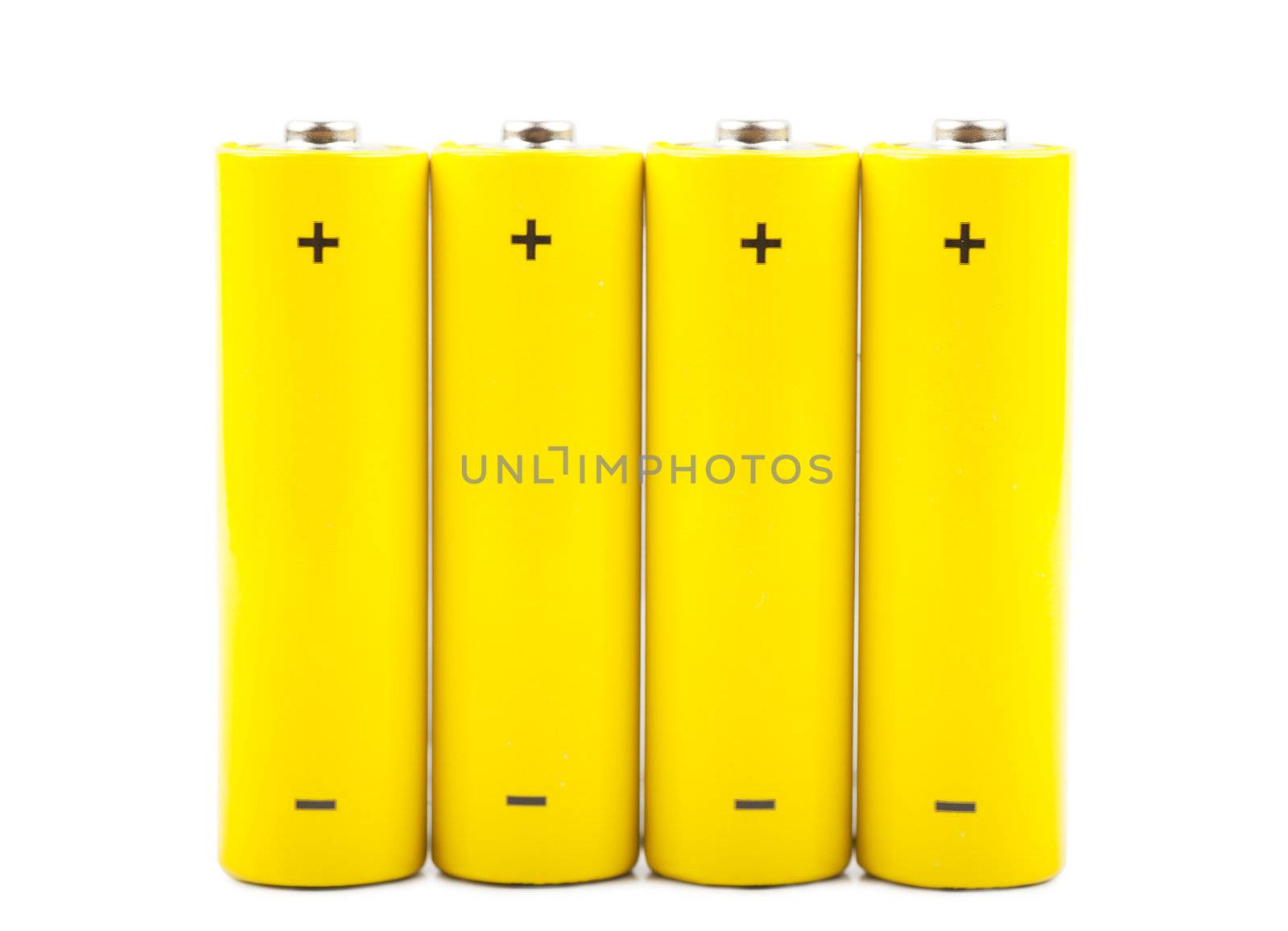 Four yellow batteries isolated over white background