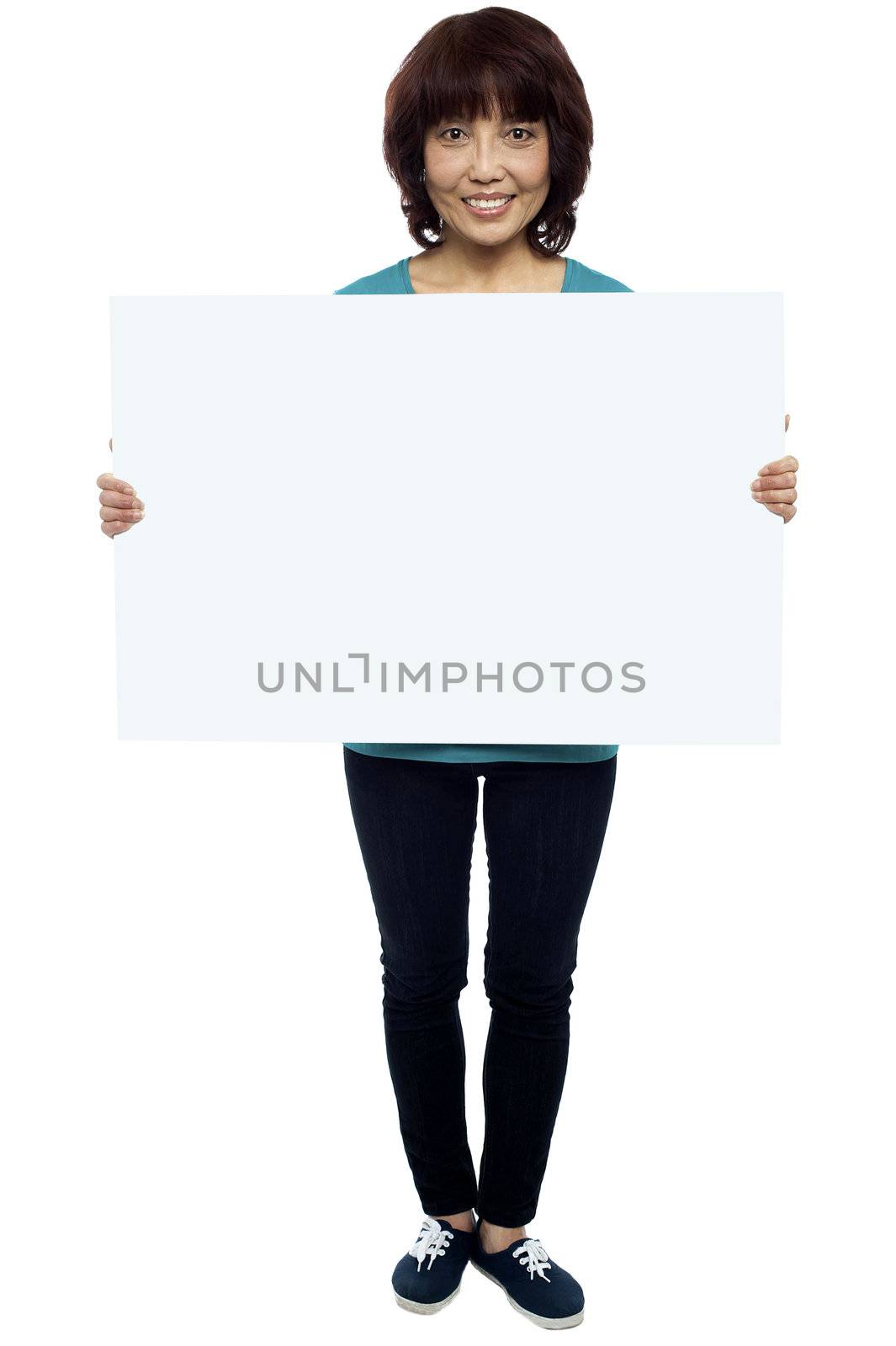 Asian female model cheerfully holding blank billboard. Full length shot