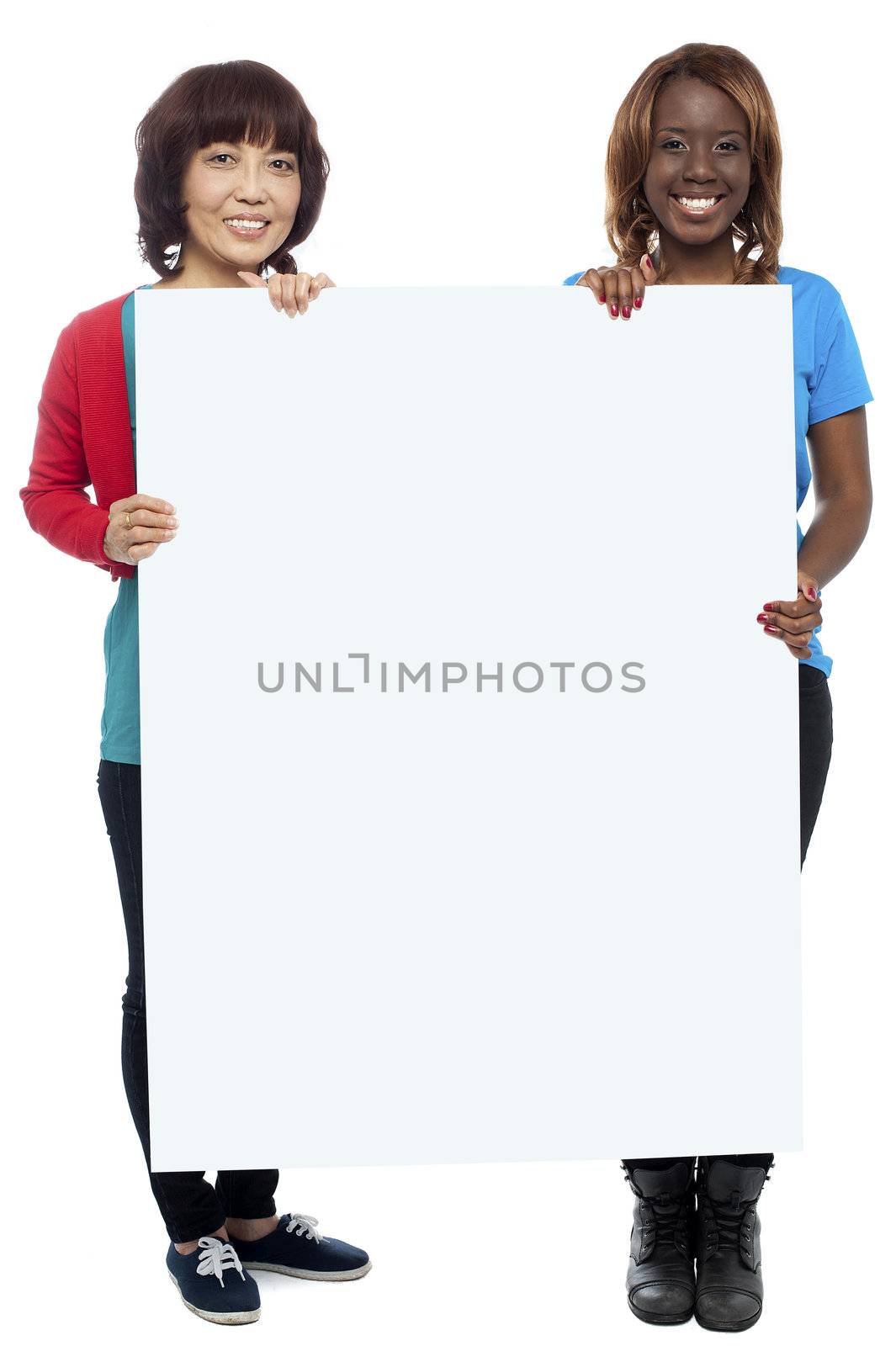 Big billboard presented by casual girls. Full length shots on white background
