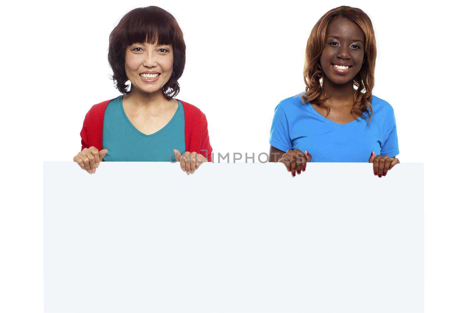 African and Asian marketing personnel holding billboard isolated against white background