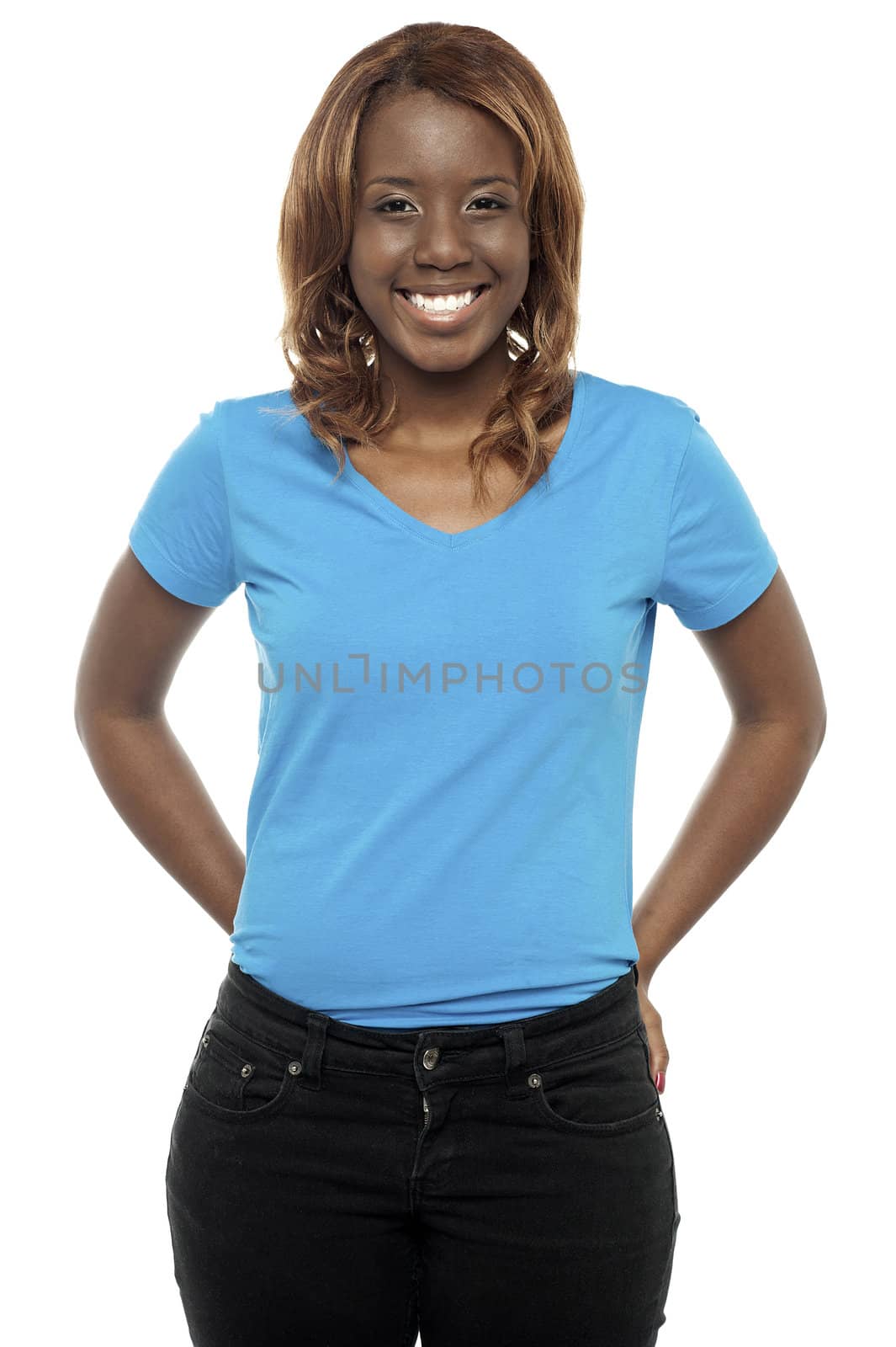 Picture of a young black woman posing in casuals. Smiling at camera