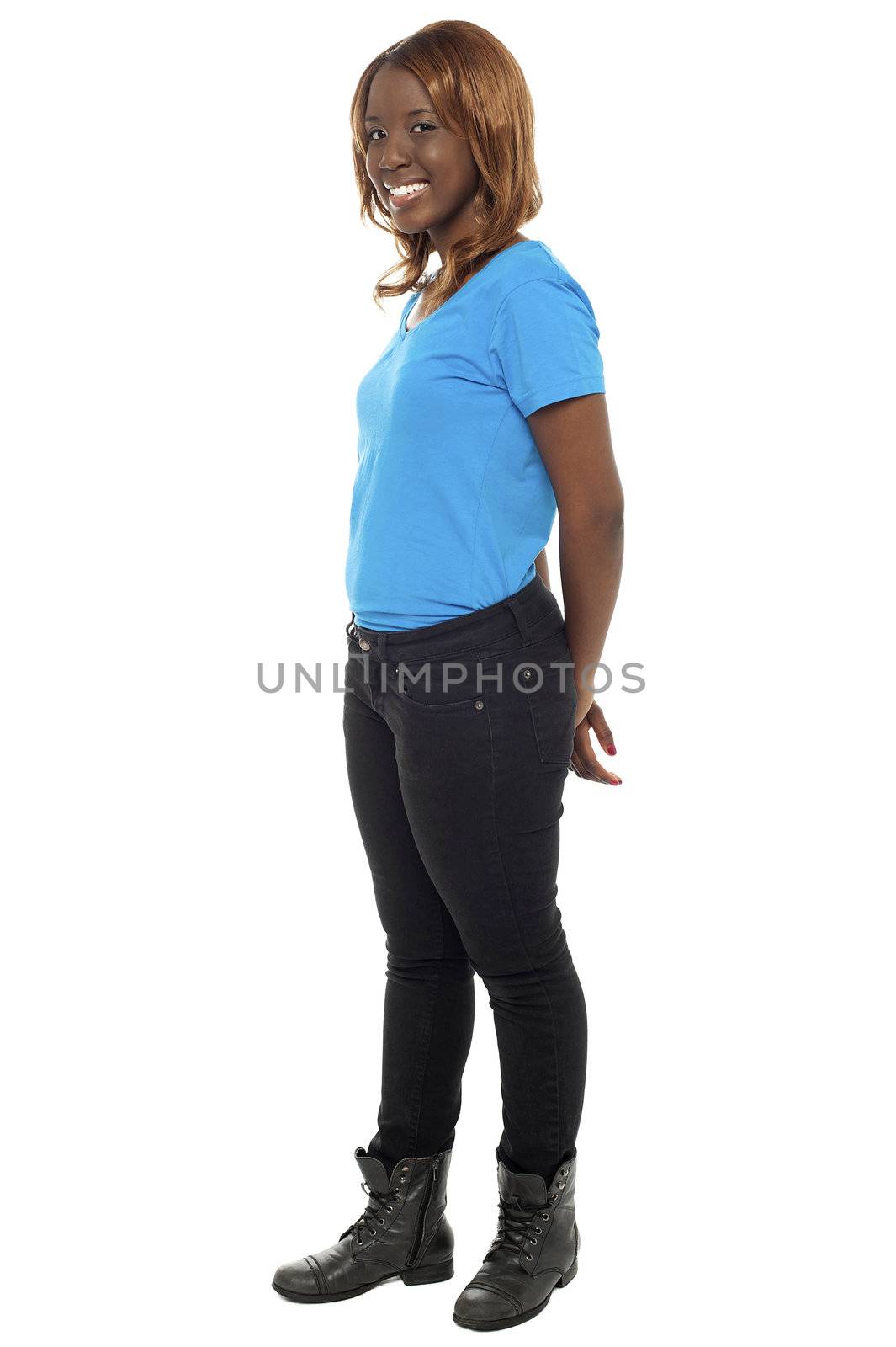 Portrait of pretty african teenage girl. Full length studio shot