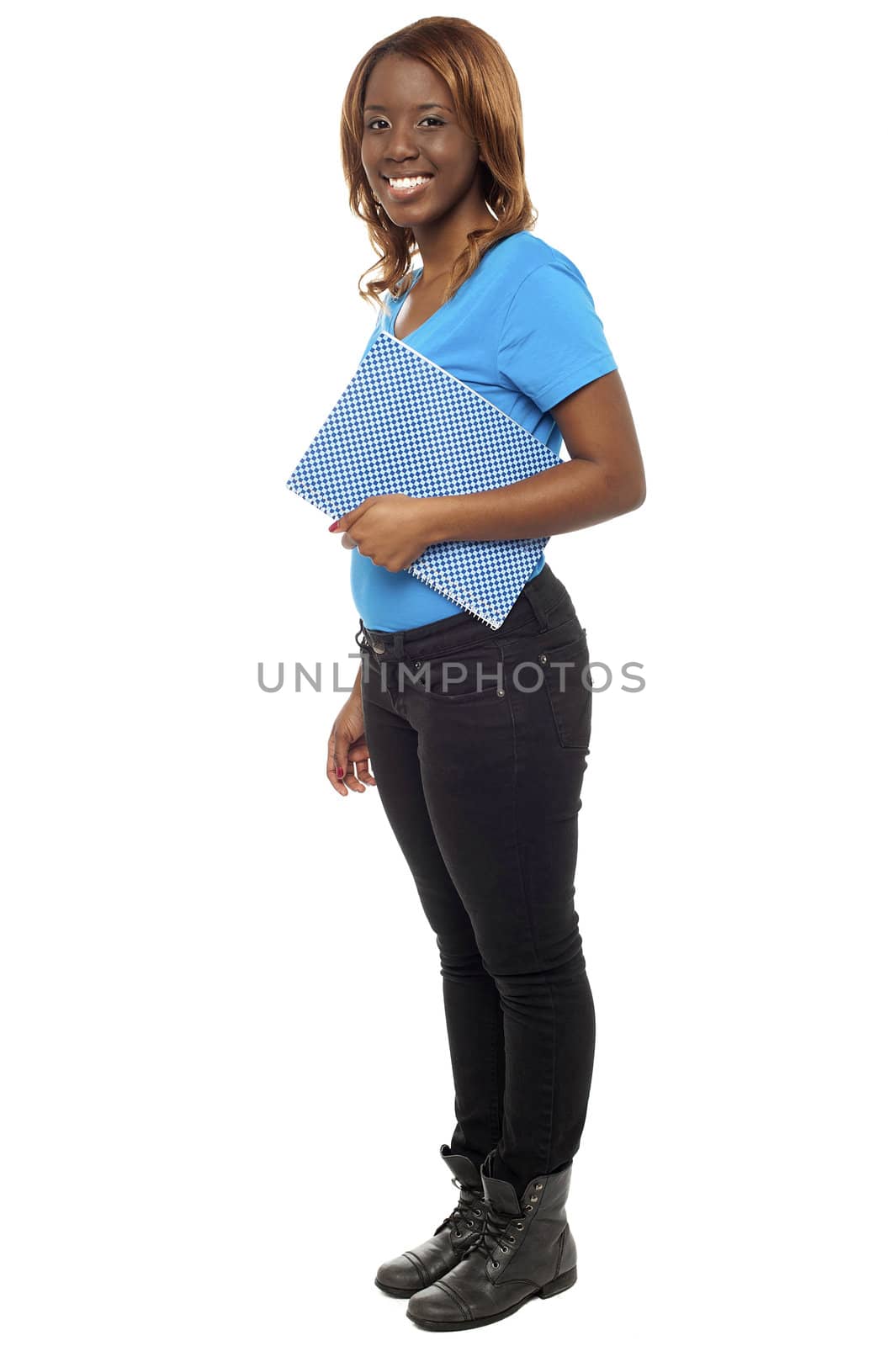 Full length portrait of pretty college student posing with her notebook