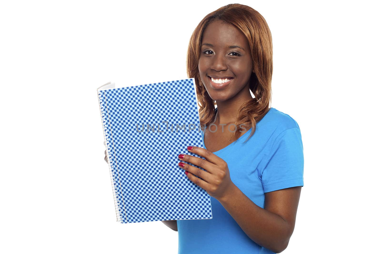 Smiling college student holding notebook and looking at camera