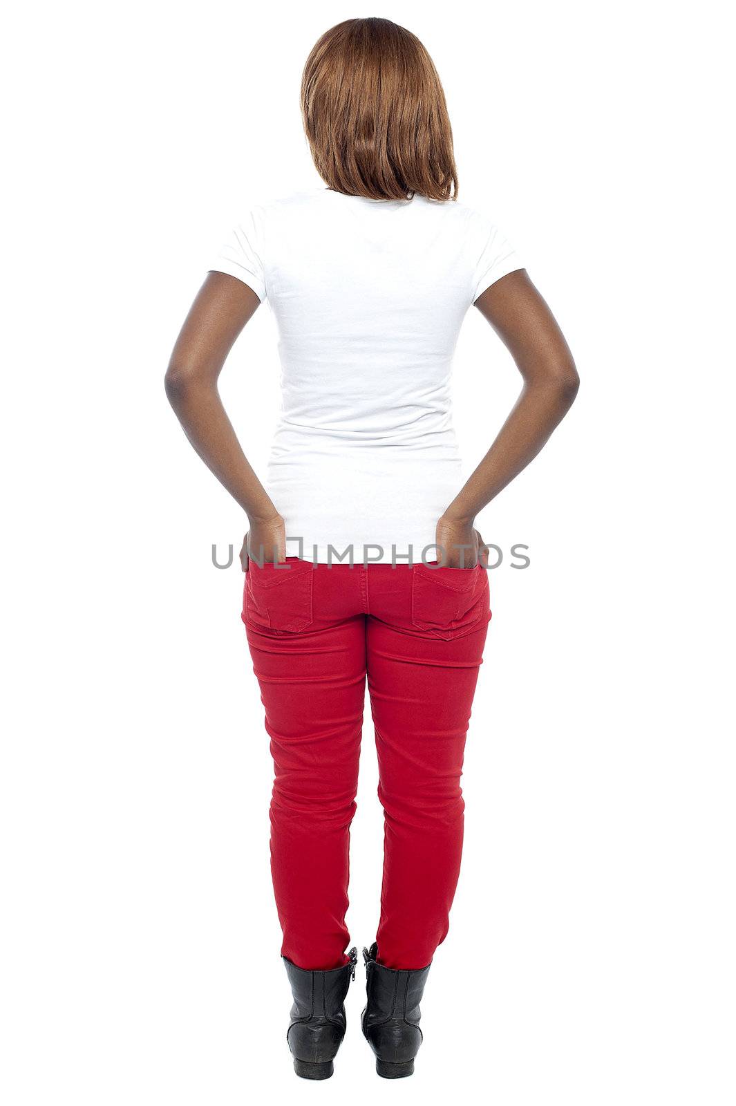 Rear view of african model. Hands in her back pocket. Full length shot