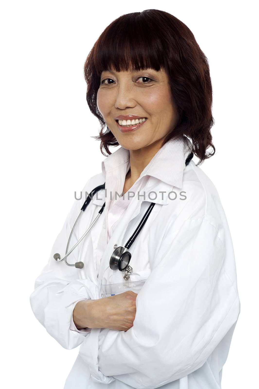 Smiling medical expert posing with arms crossed. Stethoscope around her neck