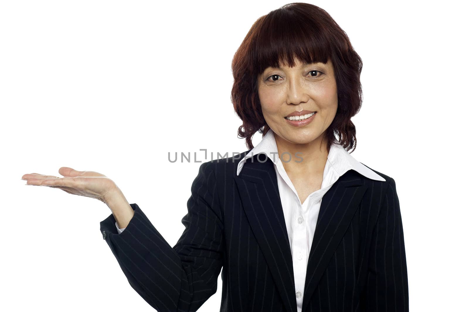 Smiling asian female presenting copy space isolated on white background