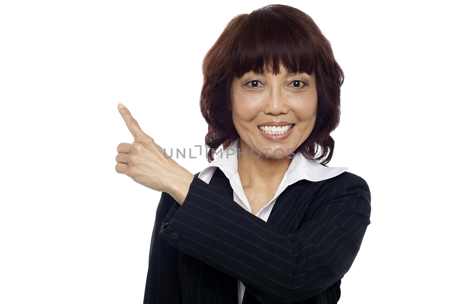 Closeup of female executive pointing away in copy space area. Isolated on white