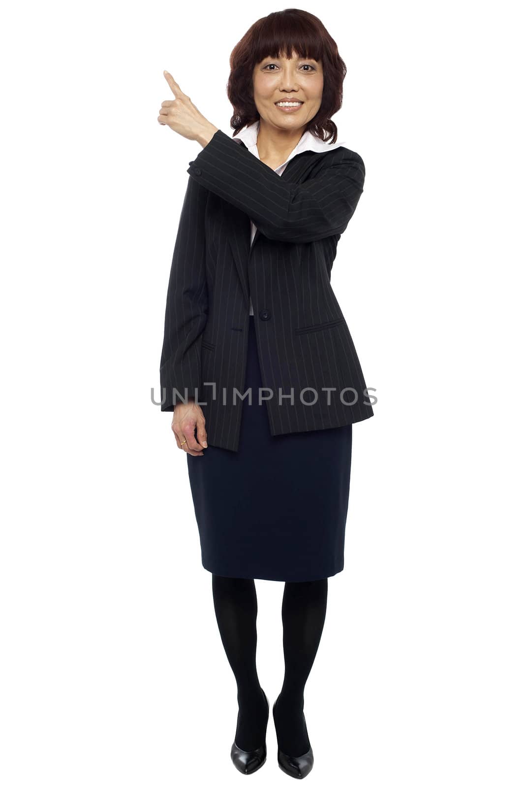 Female representative pointing at copy space area behind her. All on white background