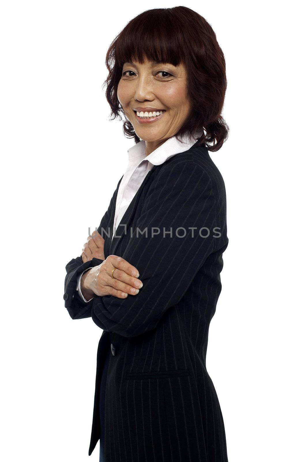 Side pose of matured asian female consultant posing with arms crossed