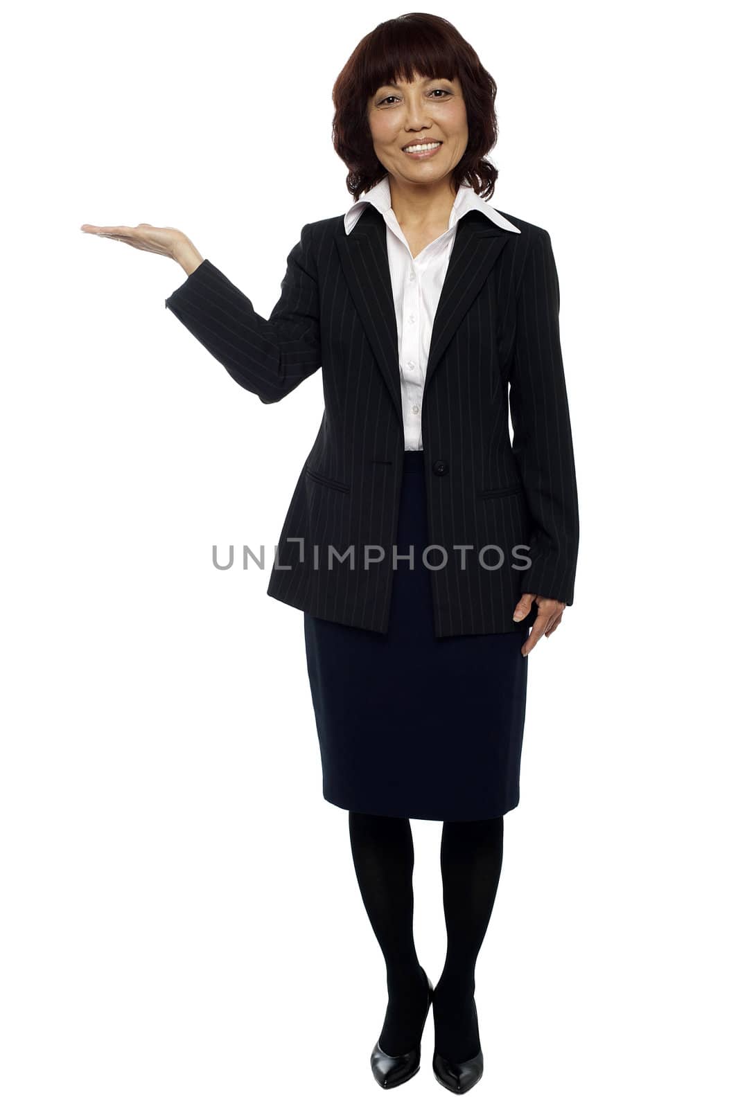 Businesswoman presenting copy space isolated over white. Full length shot