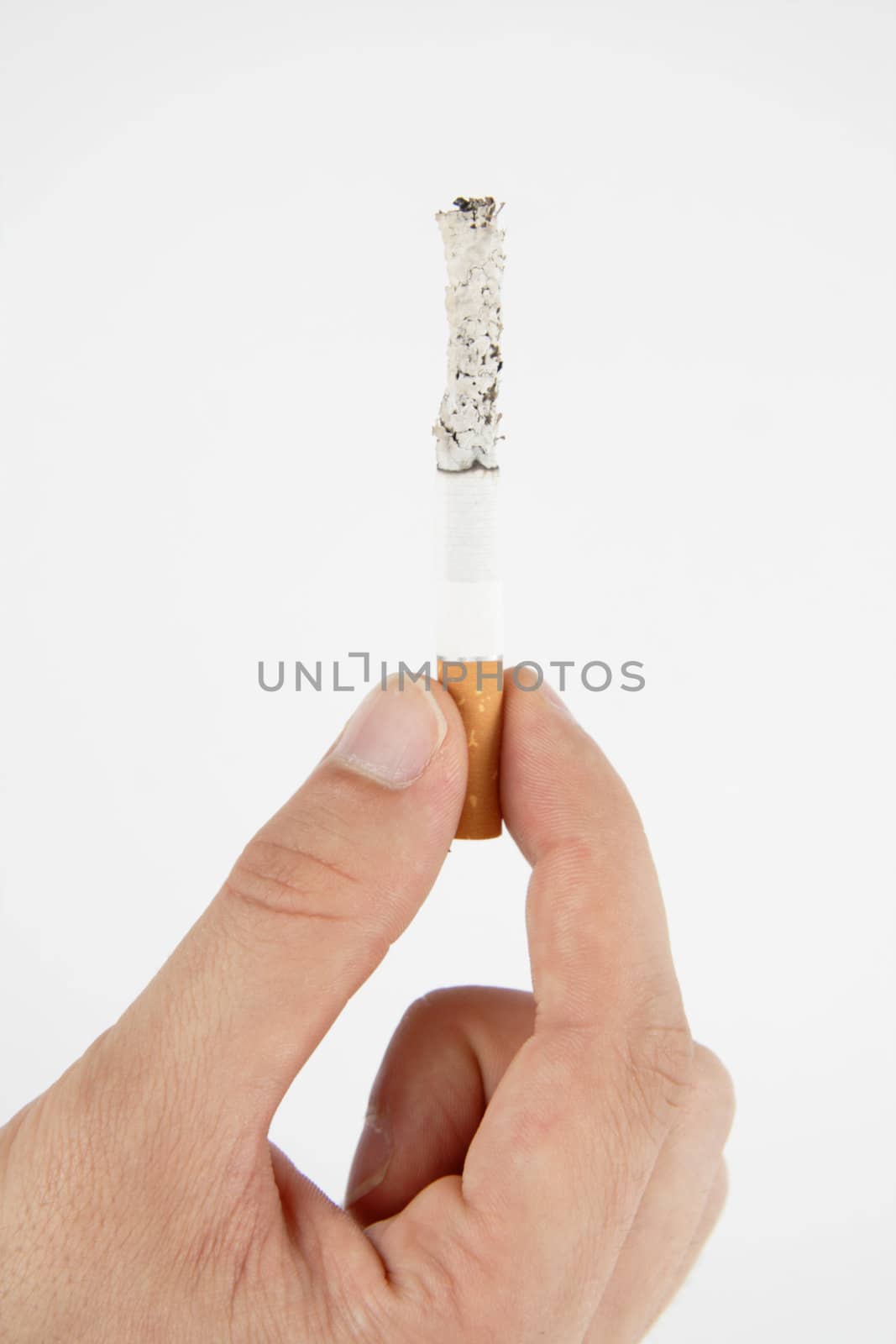Hand, holding burning cigarette on white background