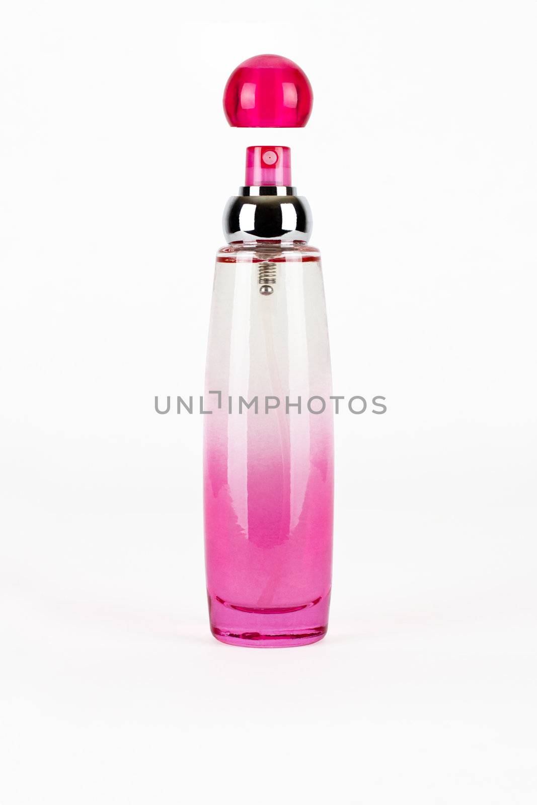 Pink parfume bottle isolated