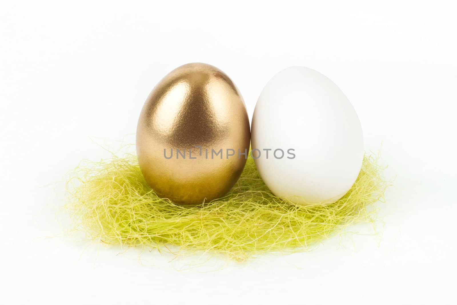 A gold egg with white egg