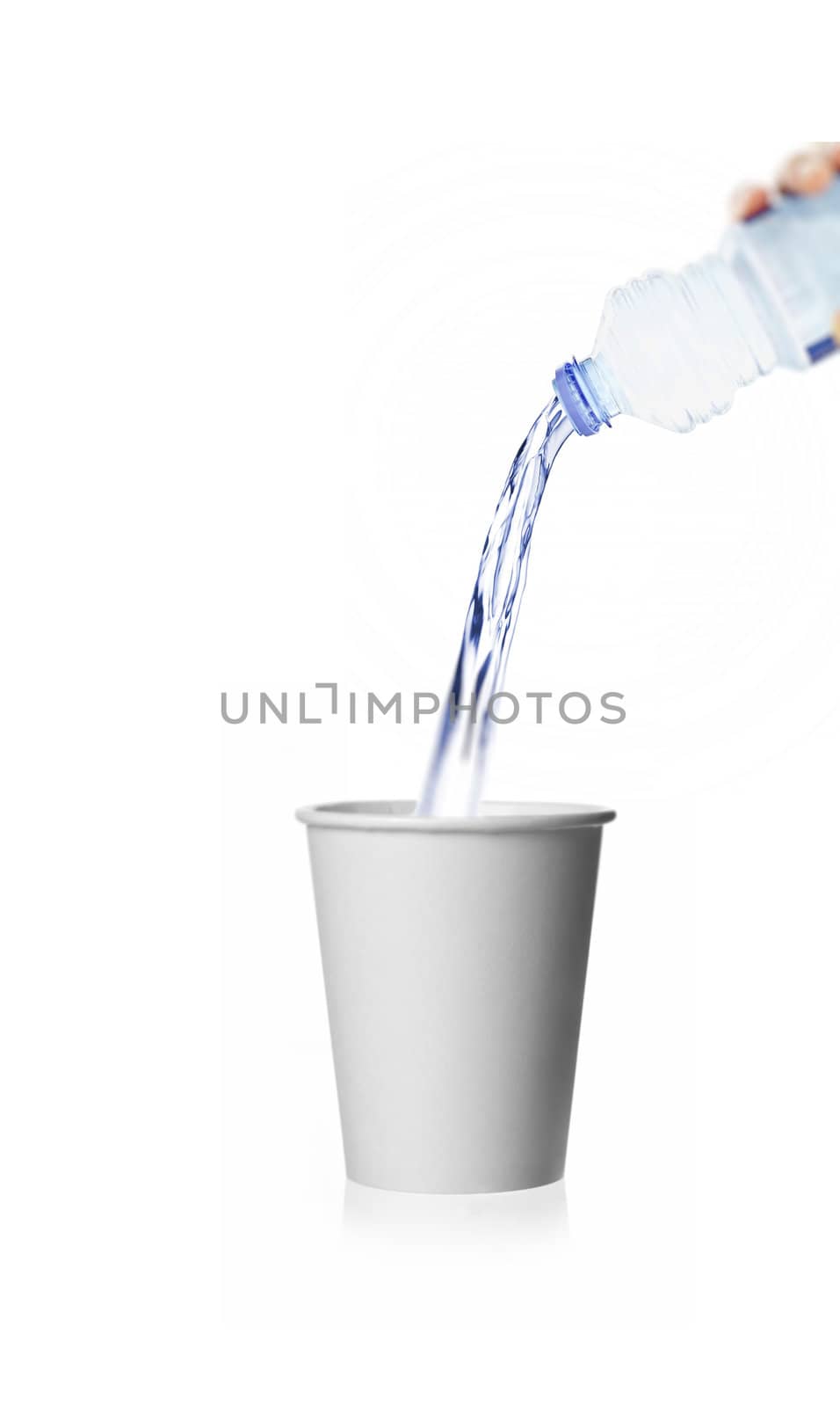 pouring water from a plastic bottle isolated against white background