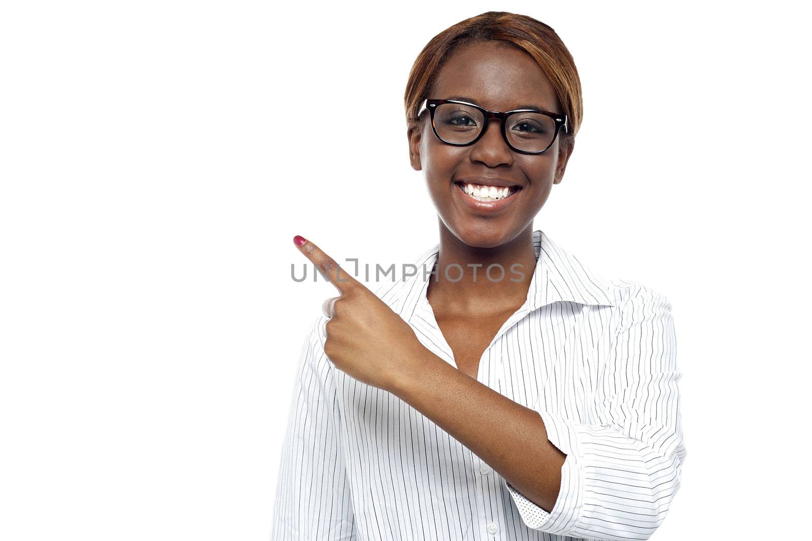 Corporate woman consultant pointing at copy space area isolated over white background