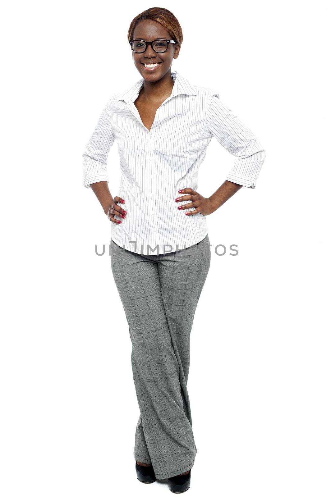 Elegant entrepreneur posing with hands on her waist. Full length shot