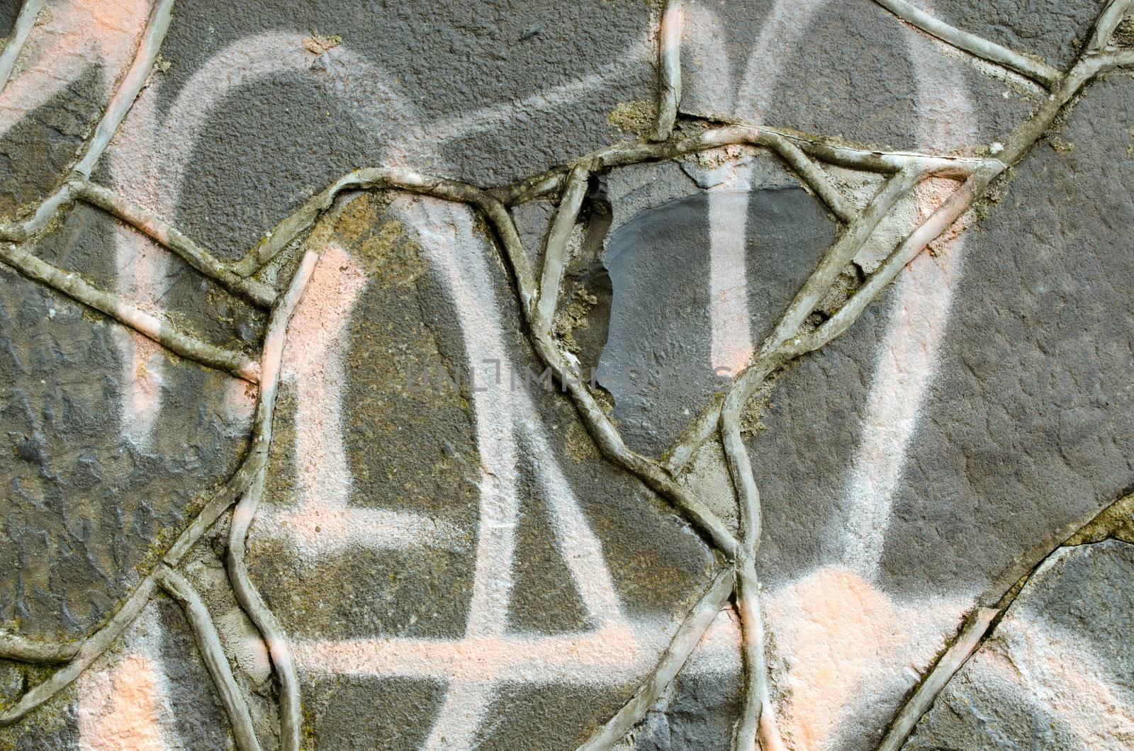 Closeup of graffiti painted masonry concrete retro wall background.