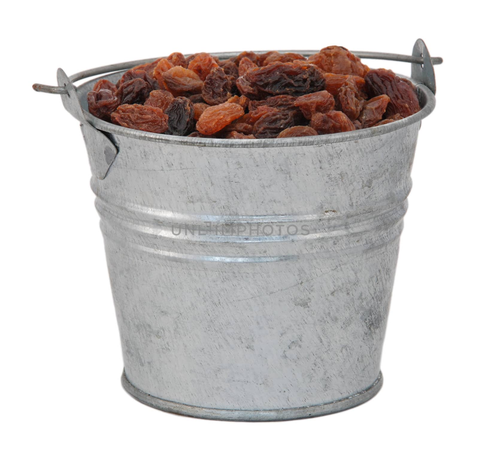 Sultanas in a miniature metal bucket, isolated on a white background