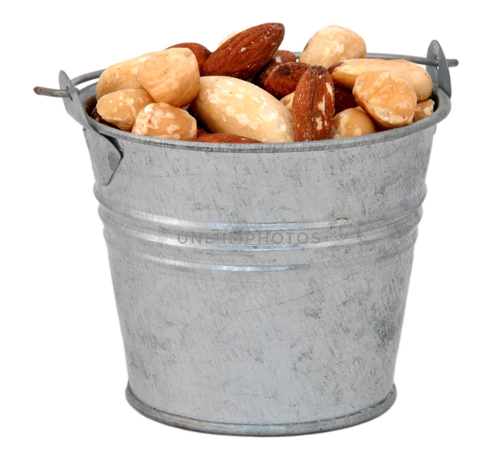 Mixed nuts in a miniature metal bucket, isolated on a white background
