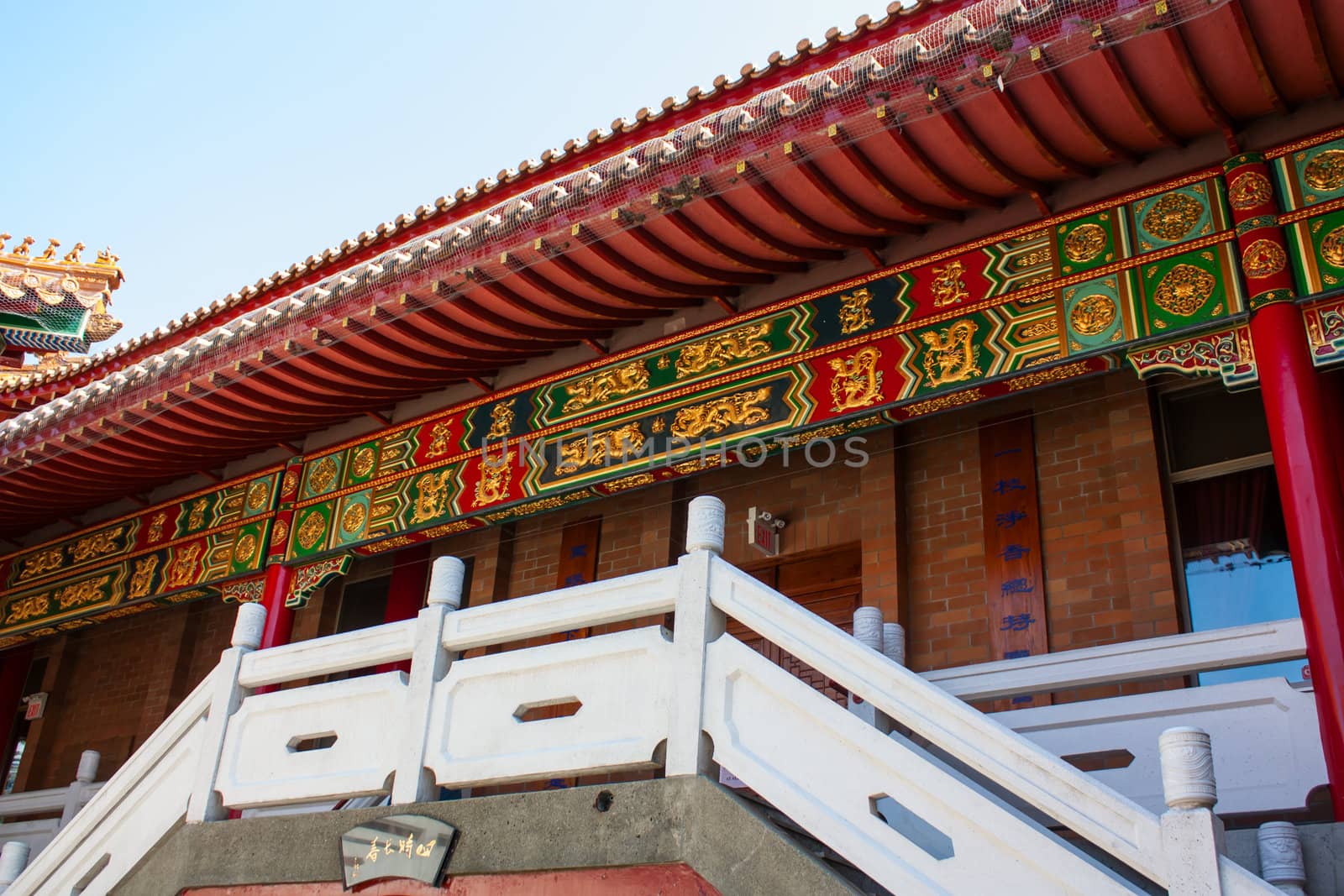 Photo of Chinese temple with stairs at sunny day.