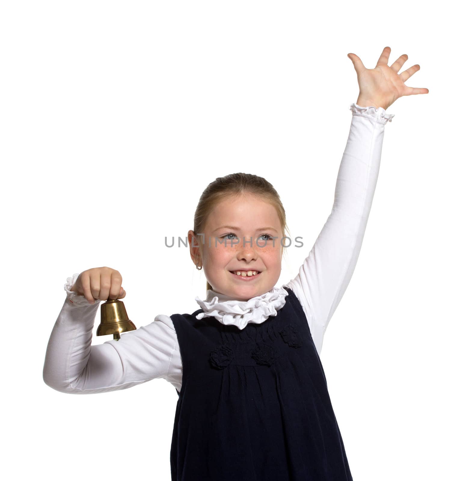 Young school girl ringing a golden bell on white background