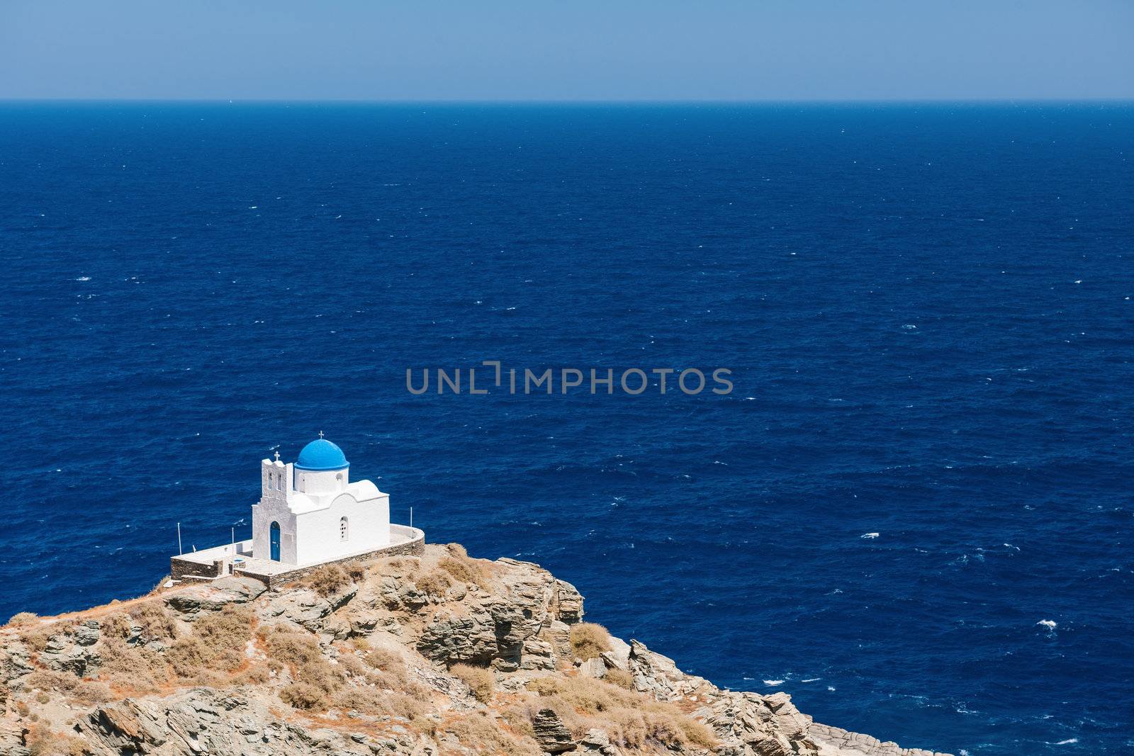 The chapel of 7 Martyrs, on the island of Sifnos, Greece, overlooking the Aegean Sea