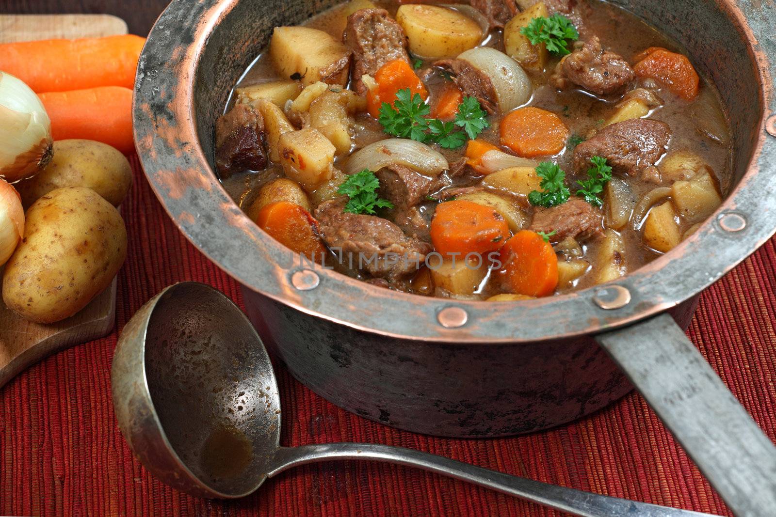 Irish stew in old copper pot by sumners