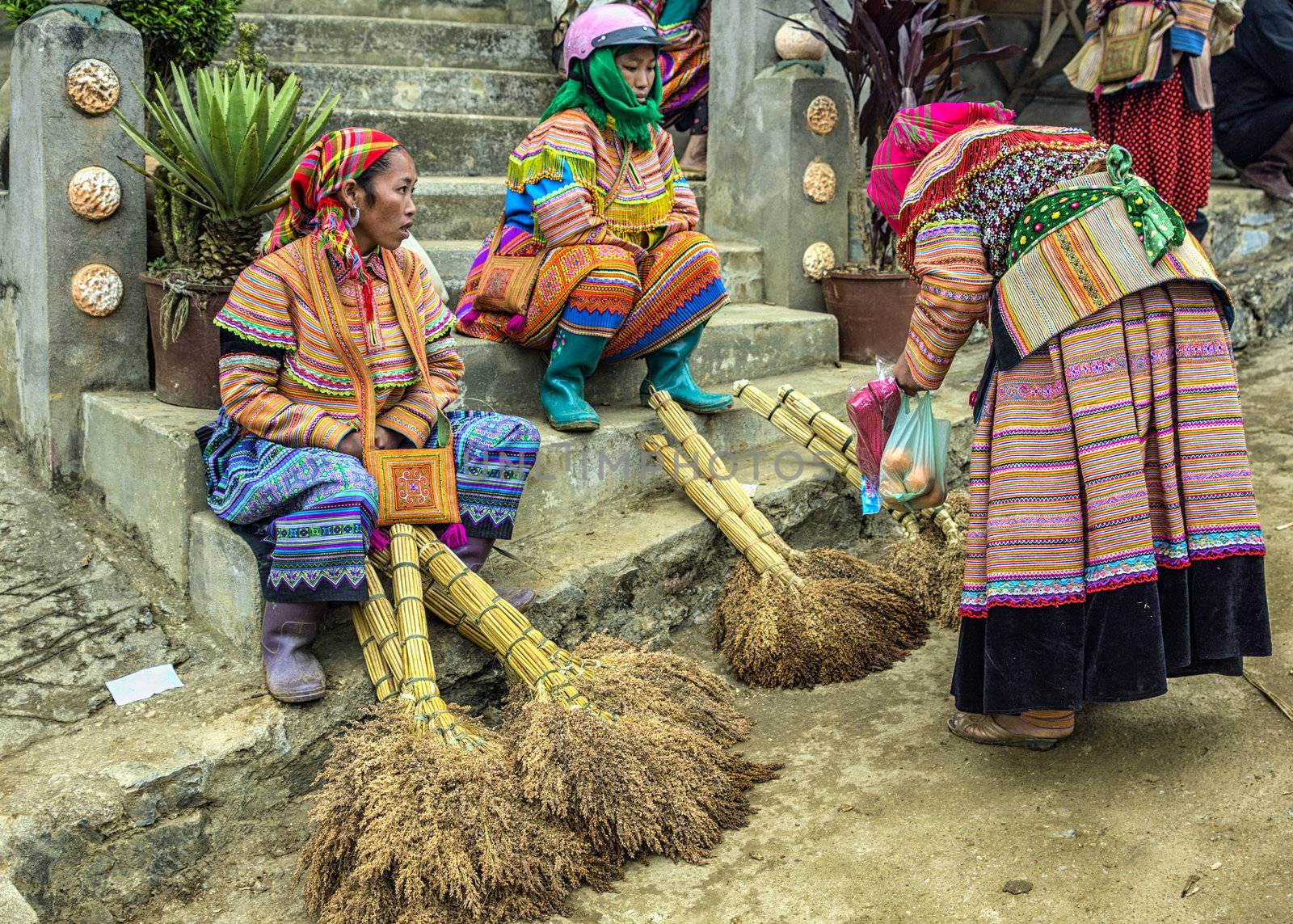 Vietnam Bac Ha - March 2012: Hmong women selling brooms on Sunda by Claudine
