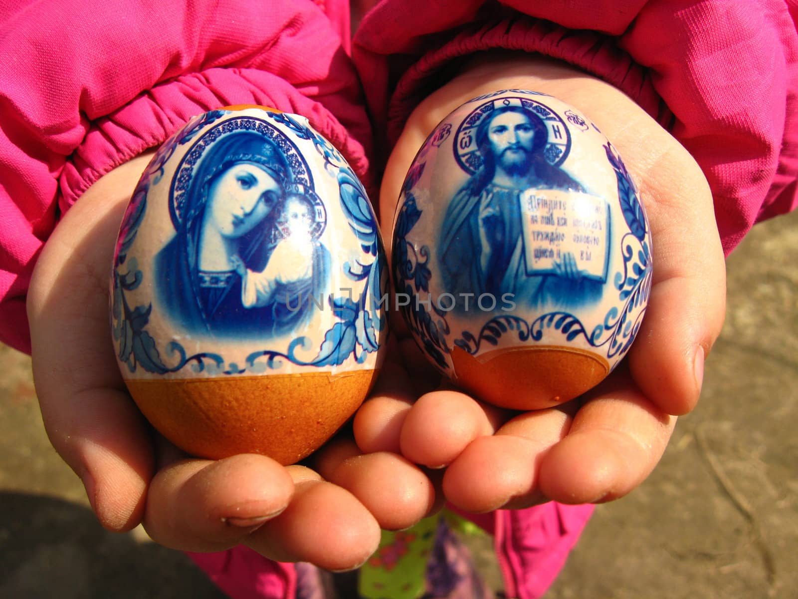 Two easter eggs in the hands of the girl