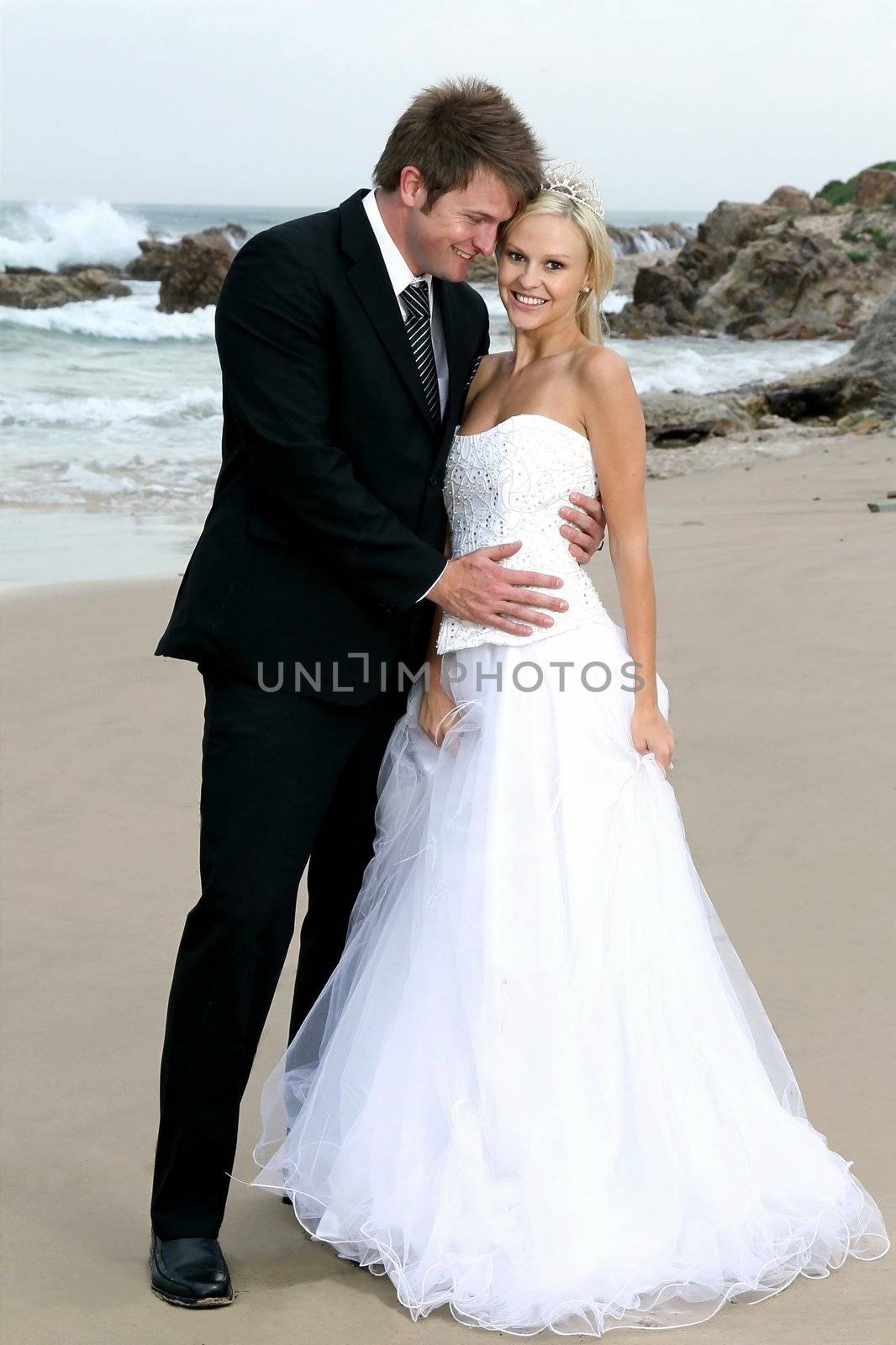 Bride and Groom on the Beach by fouroaks