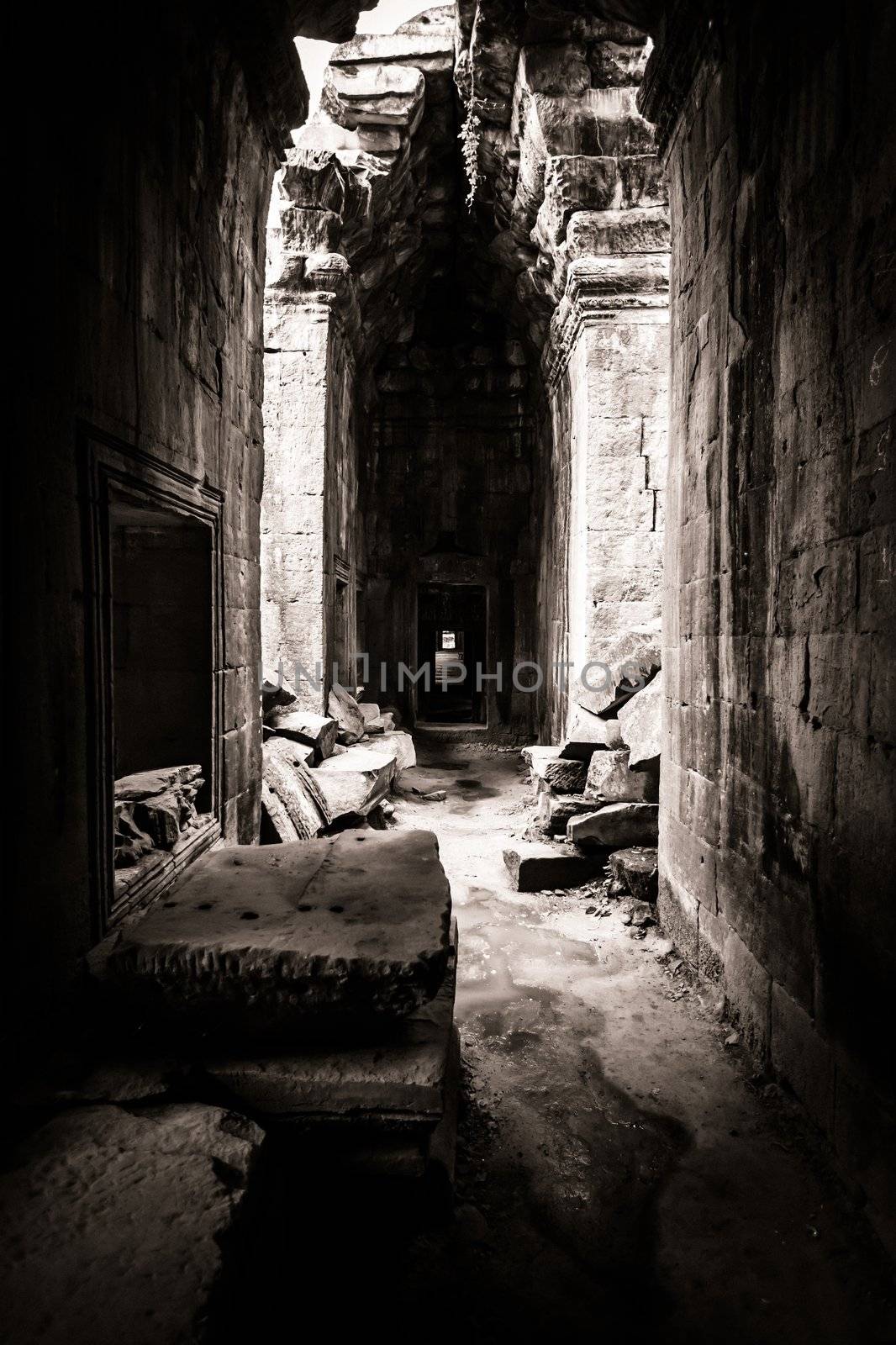 Light coming through the opening in the roof of the Cambodia ruin of Angkor Wat, Ta Prohm Temple.