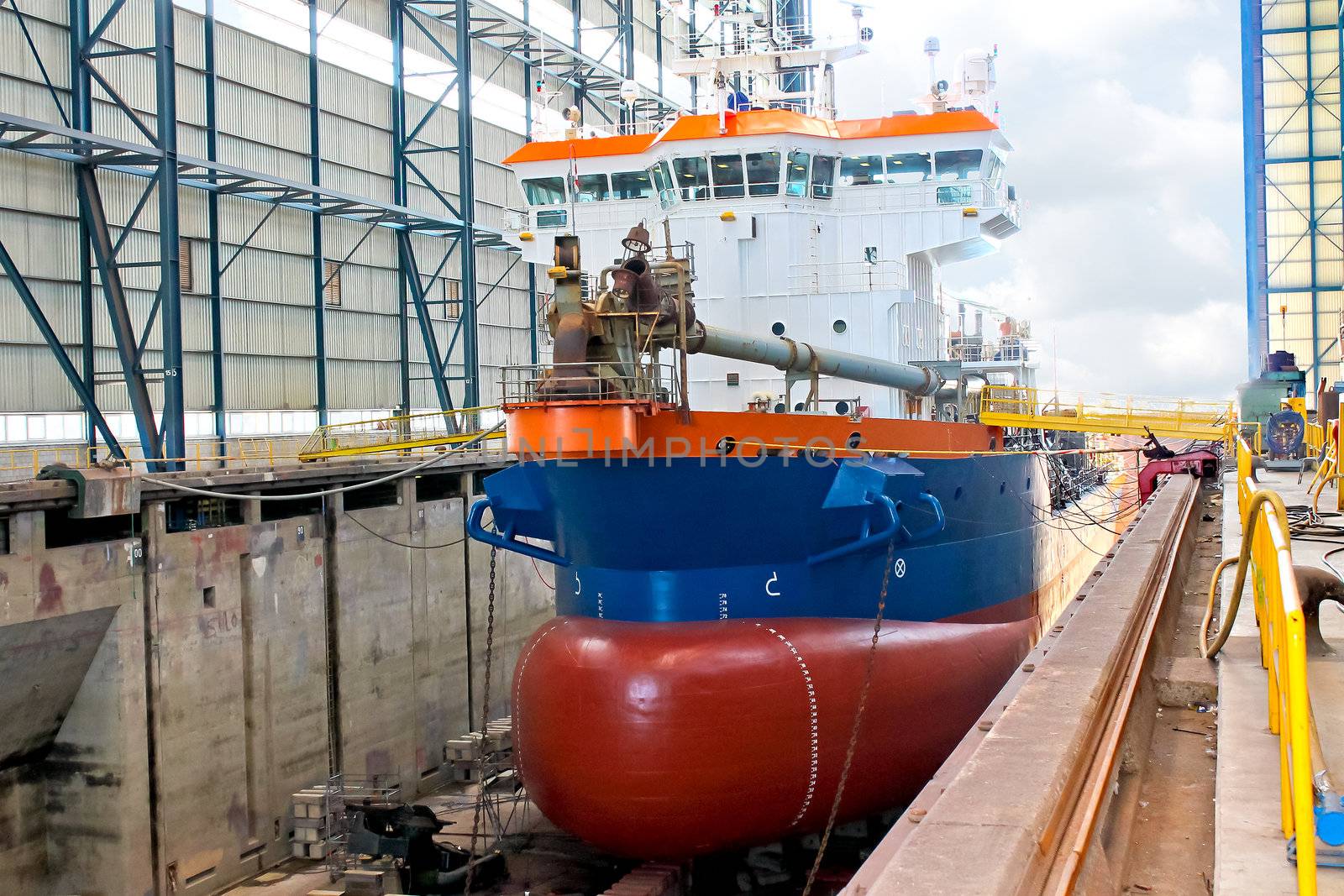 Ship in  shipyard's covered dry dock 