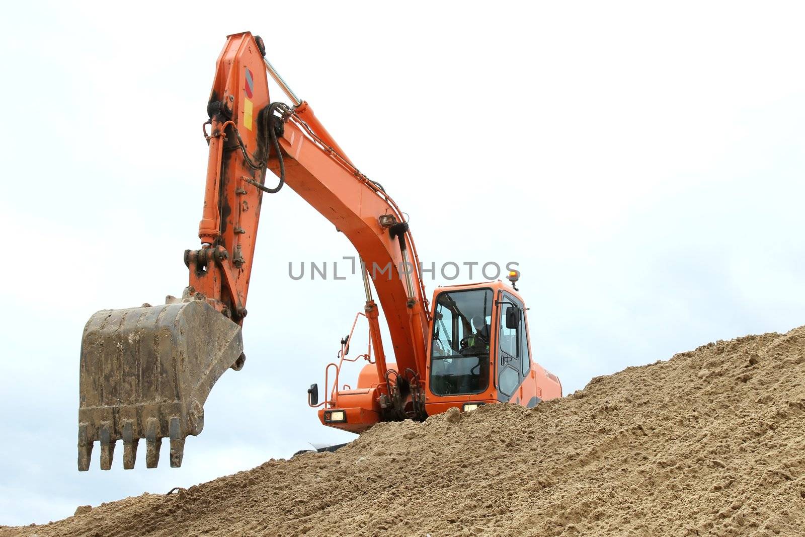 Digging machine excavation in a sandy pit