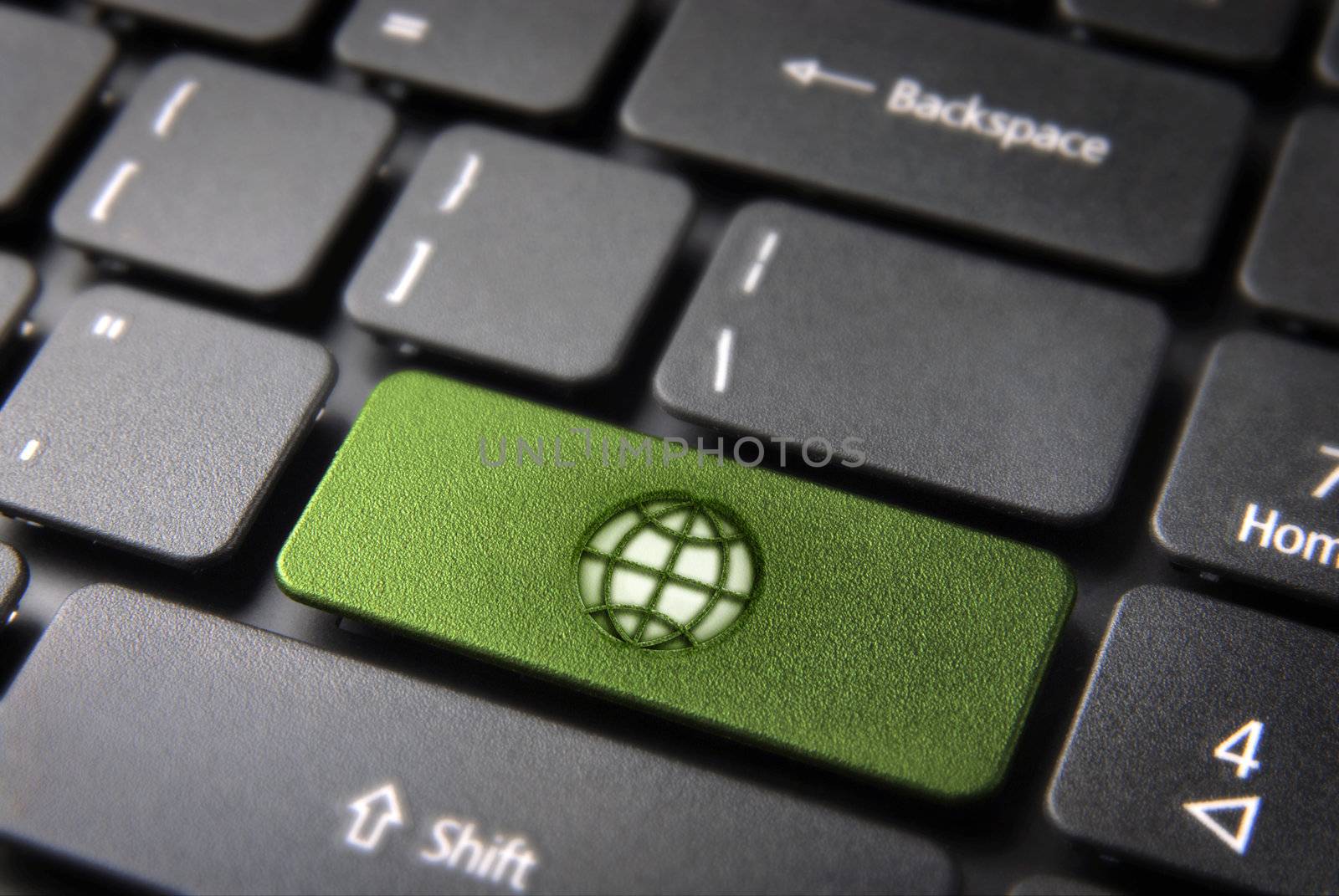 Global go green key with earth icon on laptop keyboard. Included clipping path, so you can easily edit it.