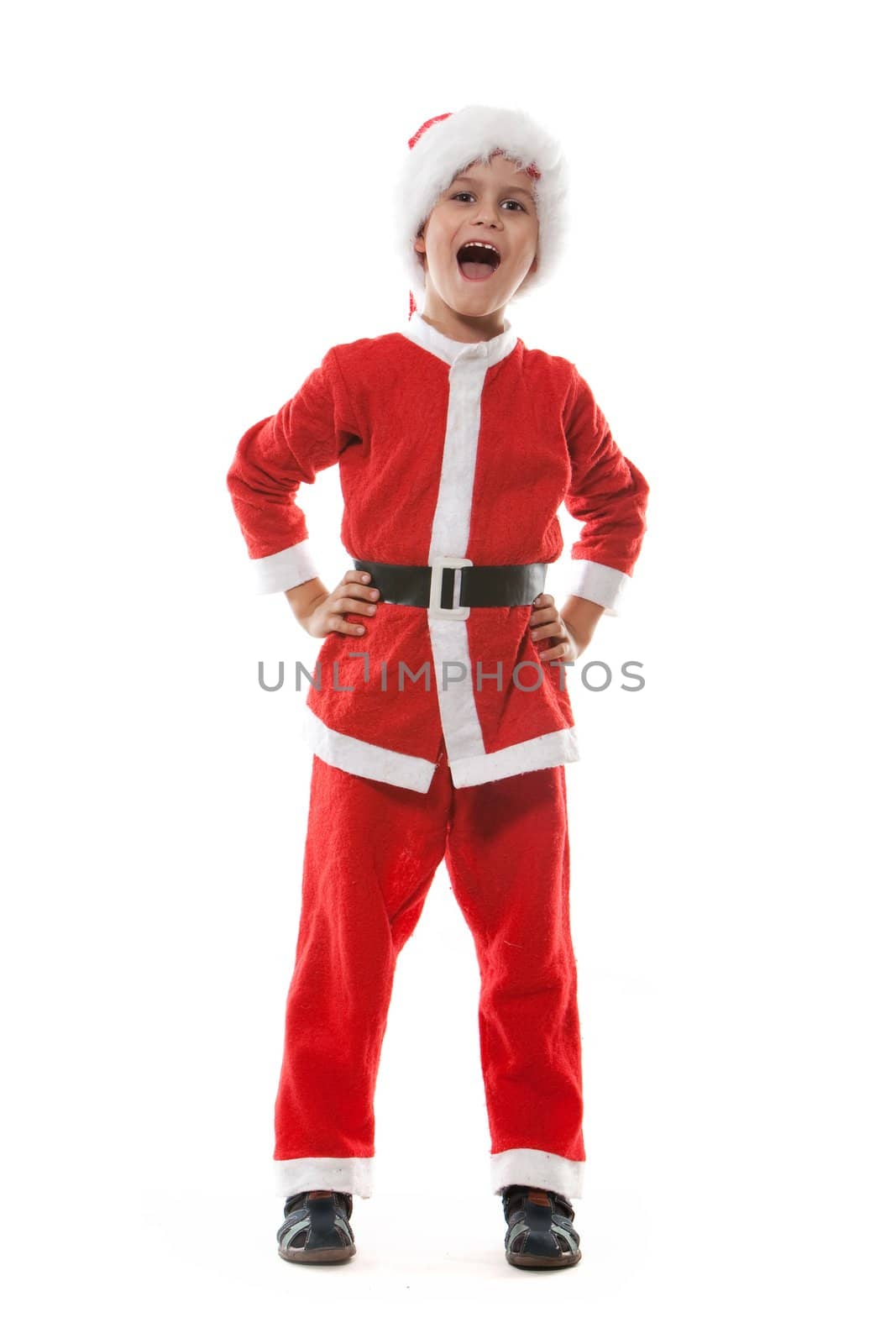 Boy dressed as Santa Claus isolated on white background