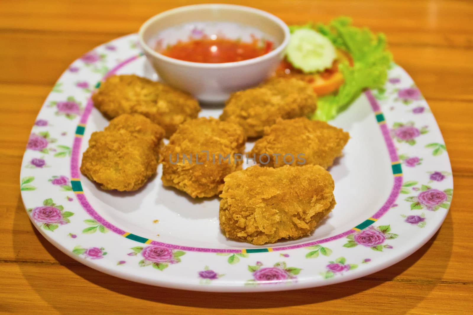 Nuggets, fried fish with sauce.