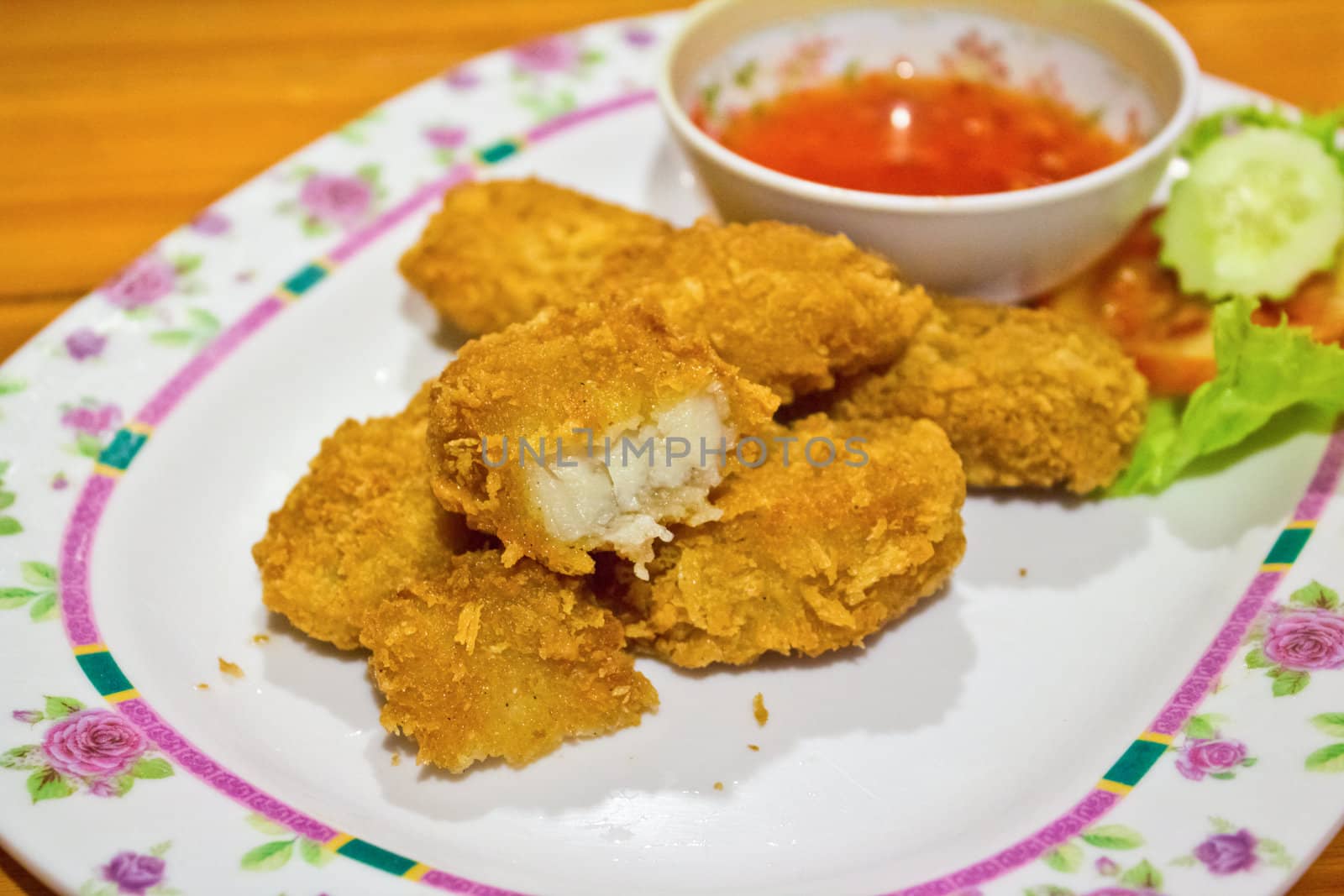 Nuggets, fried fish with sauce.