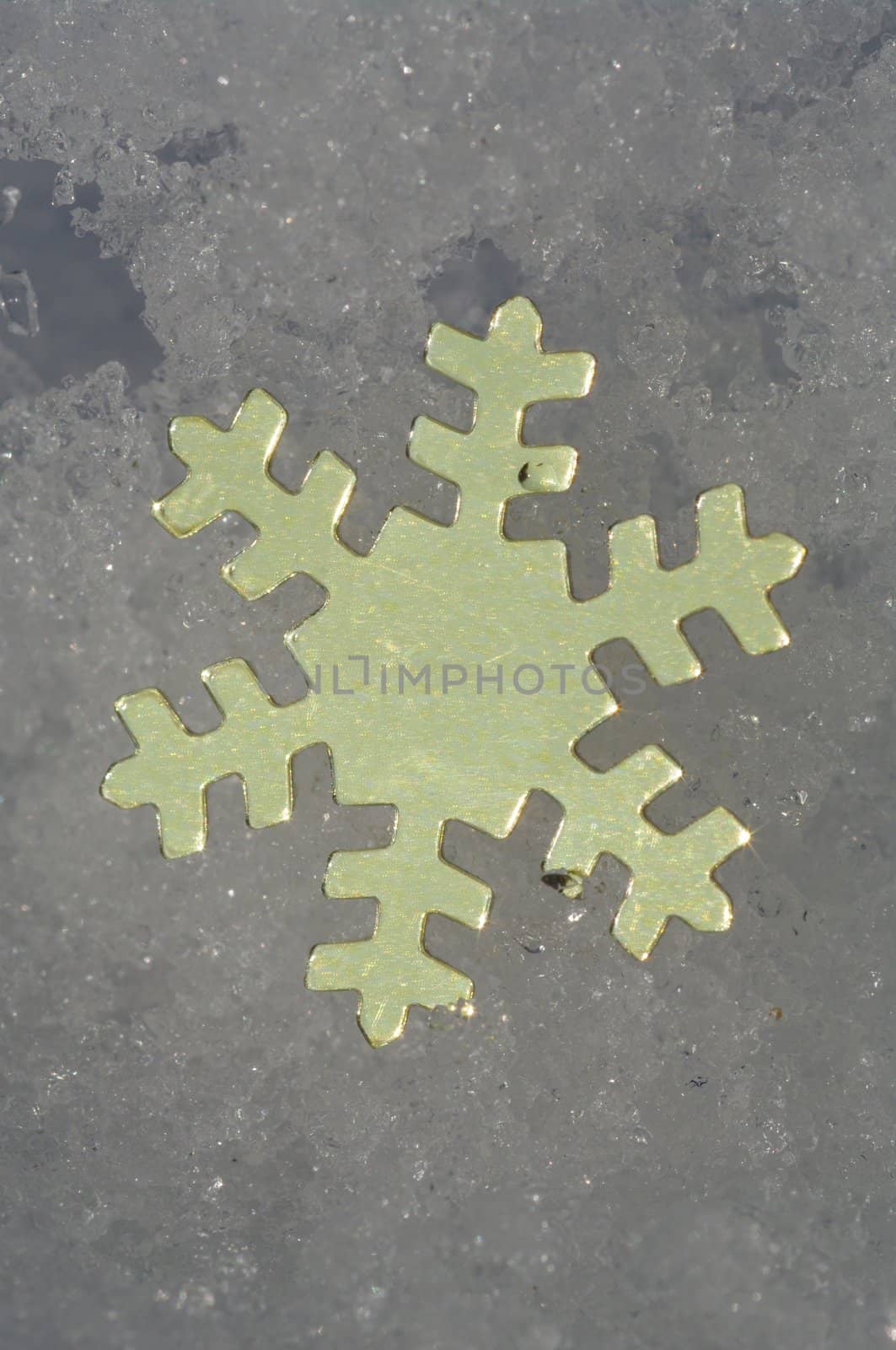 golden snow stars on a real snowy icy surface