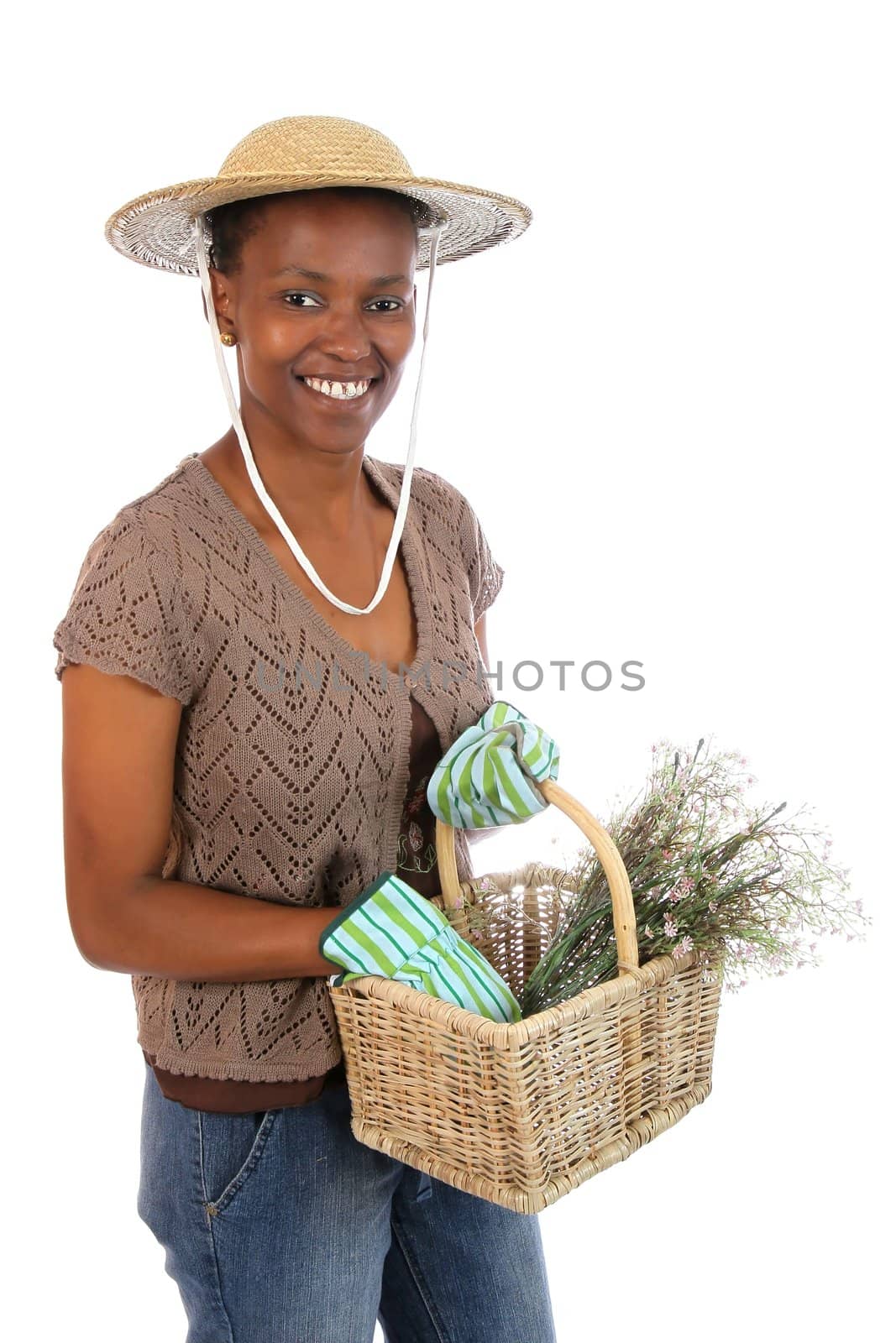 Lovely African American gardening woman with basket of flowers