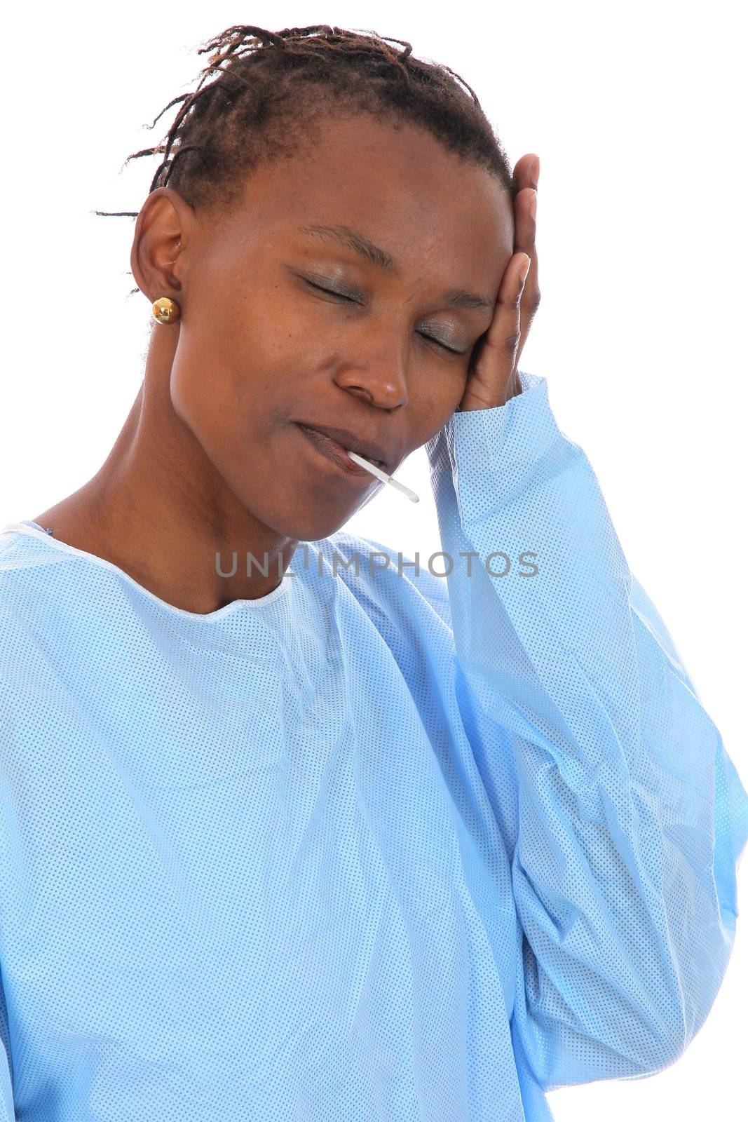 Ill African woman with  thermometer in her mouth and holding her head