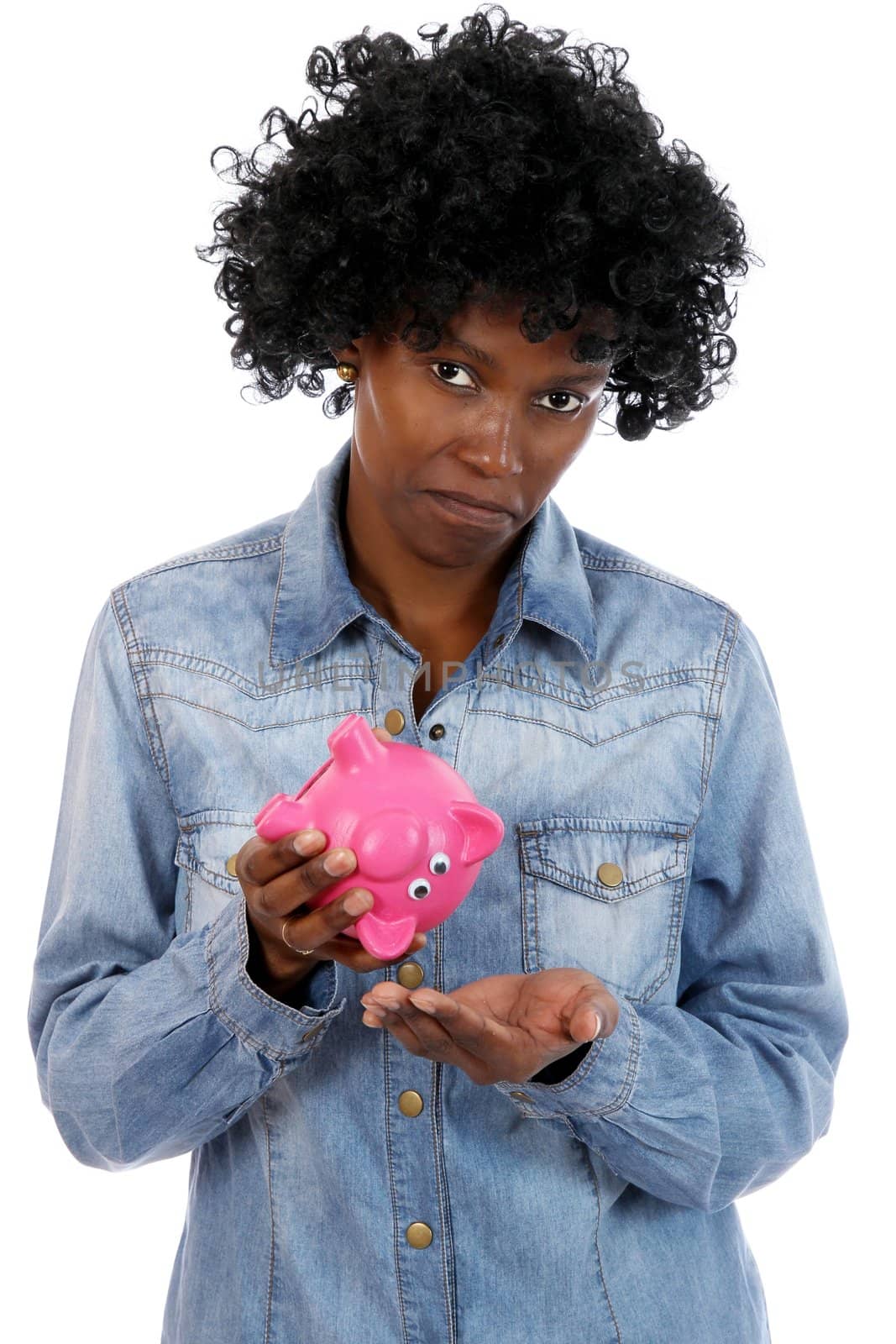 African woman with sad expression and no money left in her piggy bank