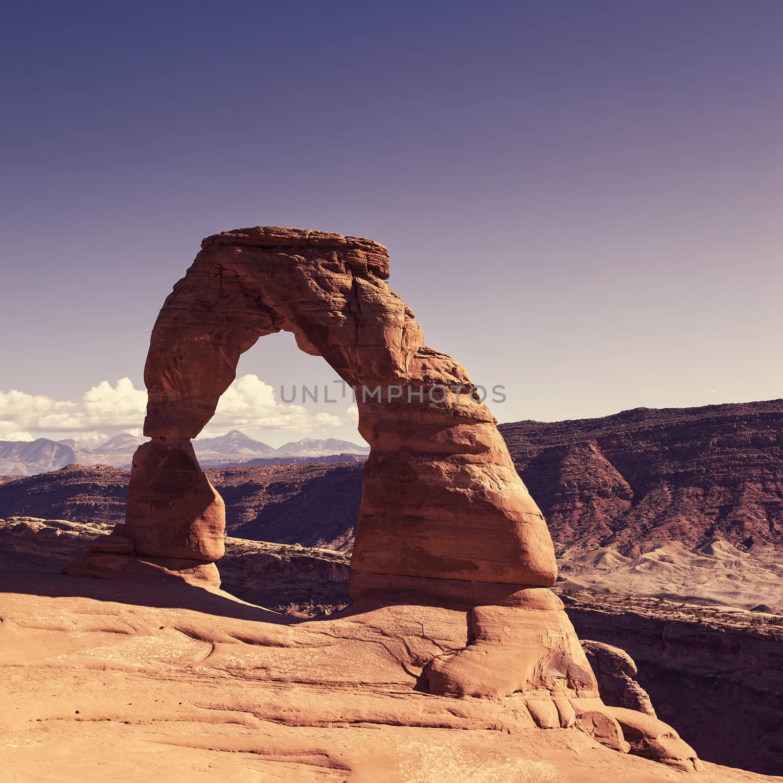 View of the famous Delicate Arch at sunset by vwalakte